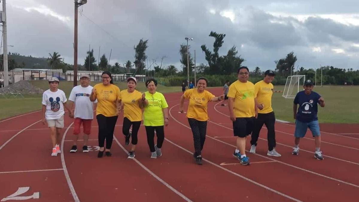 Some members and officers of the Saipan Fil-American Lions Club keep fit by walking at the Oleai track and field. Contributed photo