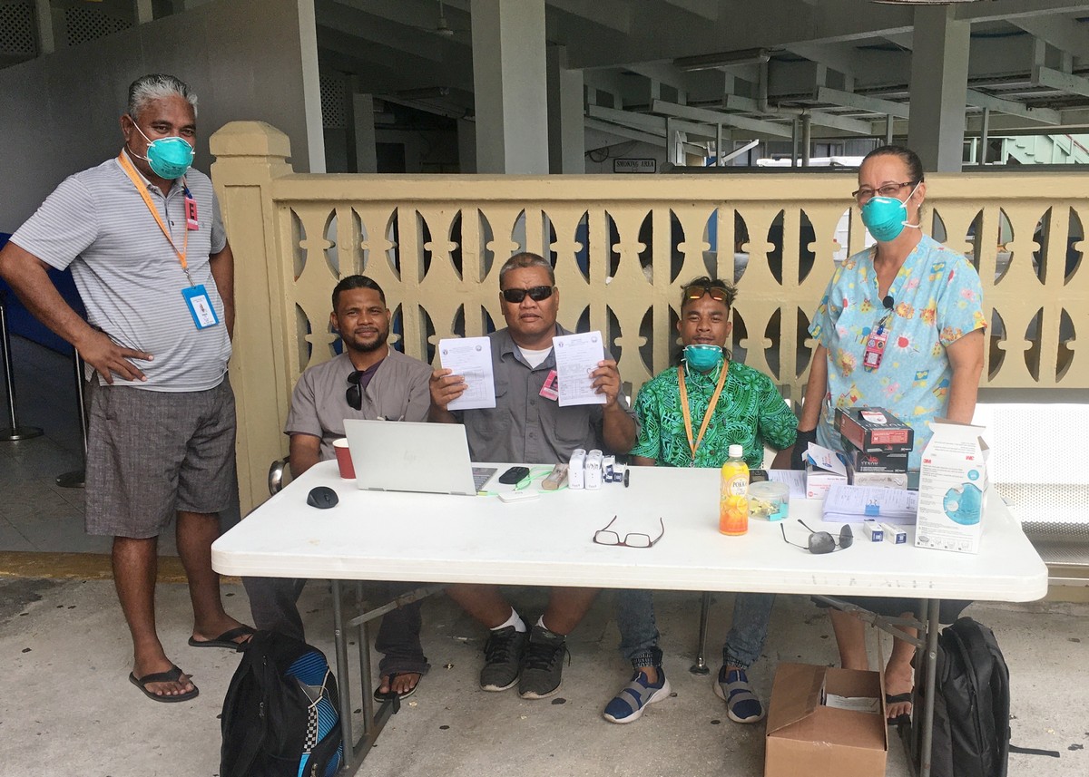 Ohio Department of Health Director Dr. Amy Acton, second from left, Ohio Lt. Gov. Jon Husted, center, and Gov. Mike DeWine walk into a coronavirus news conference, Sunday, at the Ohio Statehouse in Columbus, Ohio. AP