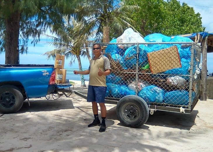 Community volunteer Max Aguon shows the trailer full of trash bags that he will transport to the Lower Base transfer station. Contributed photos