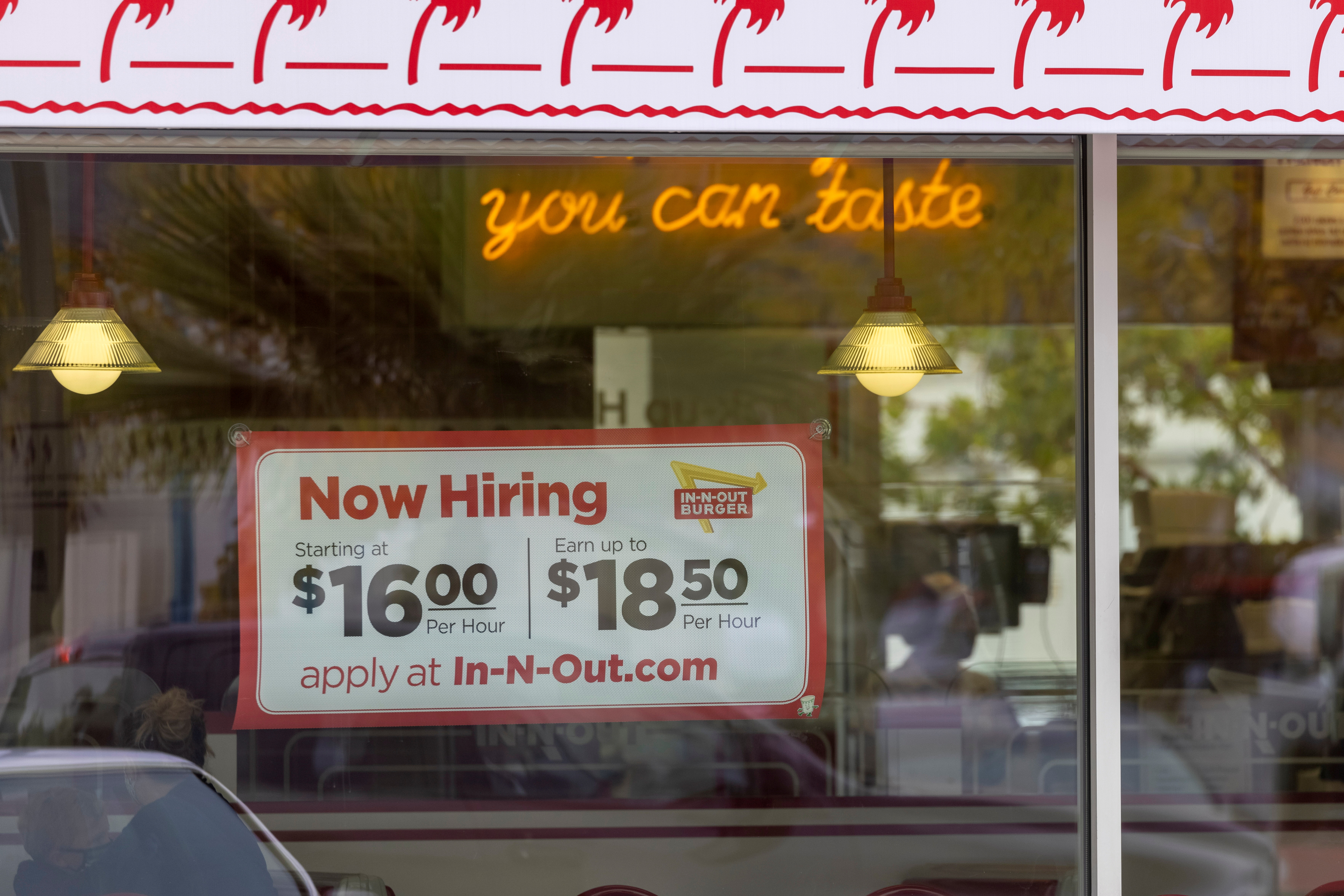 An In-N-Out Burger advertises for workers at their restaurants location in Encinitas, California on May 10, 2021.