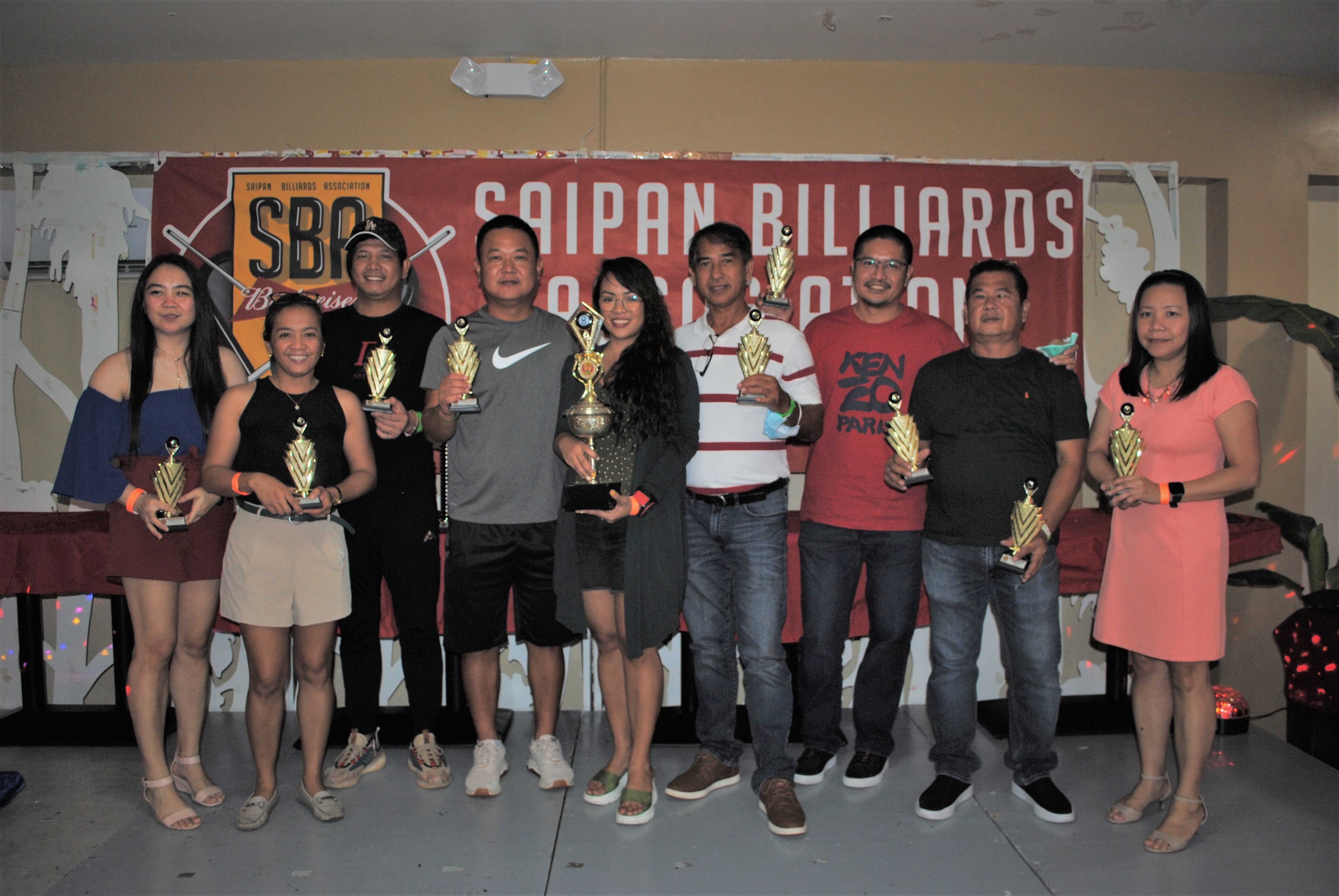 Members of Team Just Chillin' SCS pose with the Thursday Bud Cup trophies.
