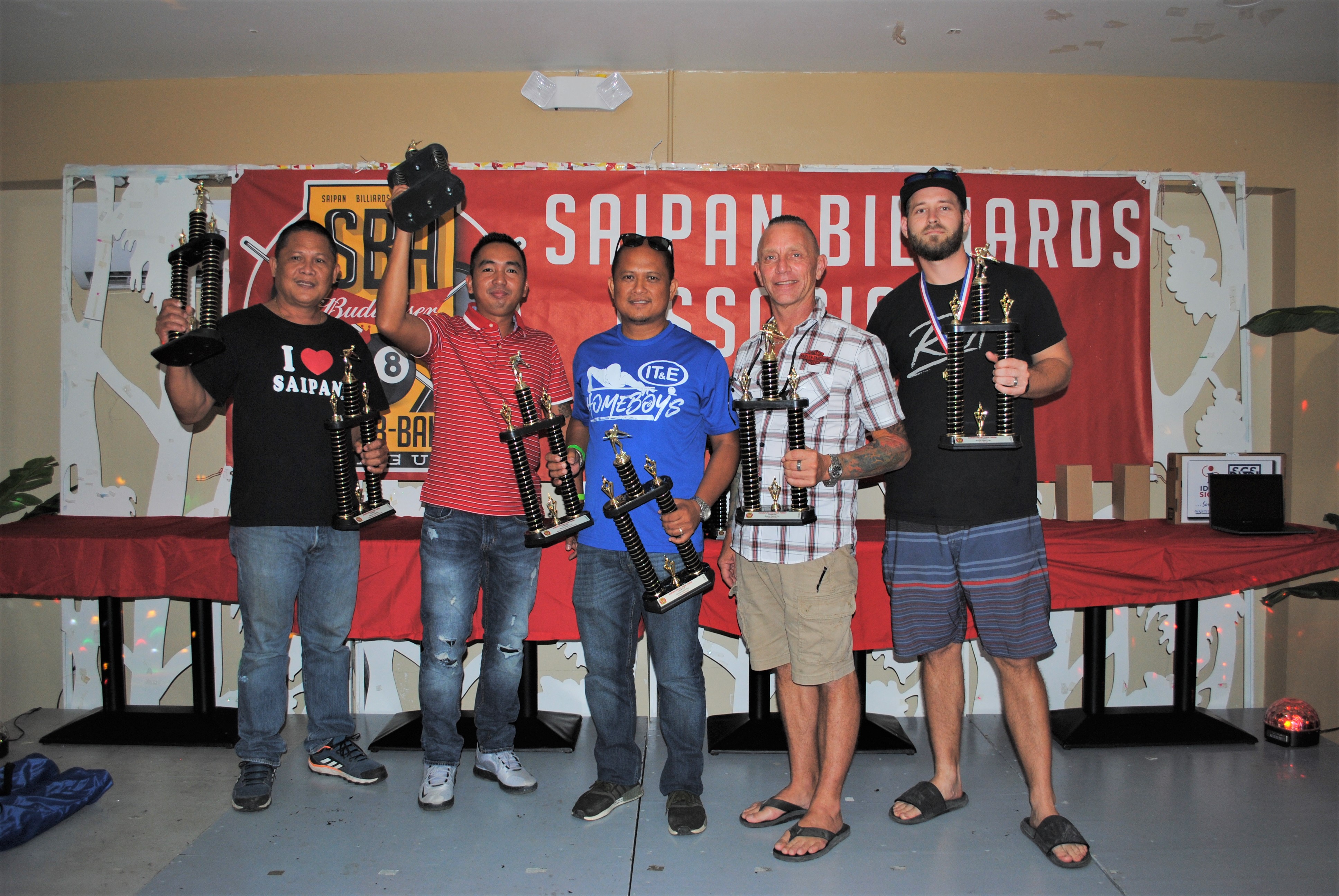 The Marpac Eagle’s Eye team members pose with the Thursday Division 1st place trophies of the SBA Budweiser Open 8-Ball League.