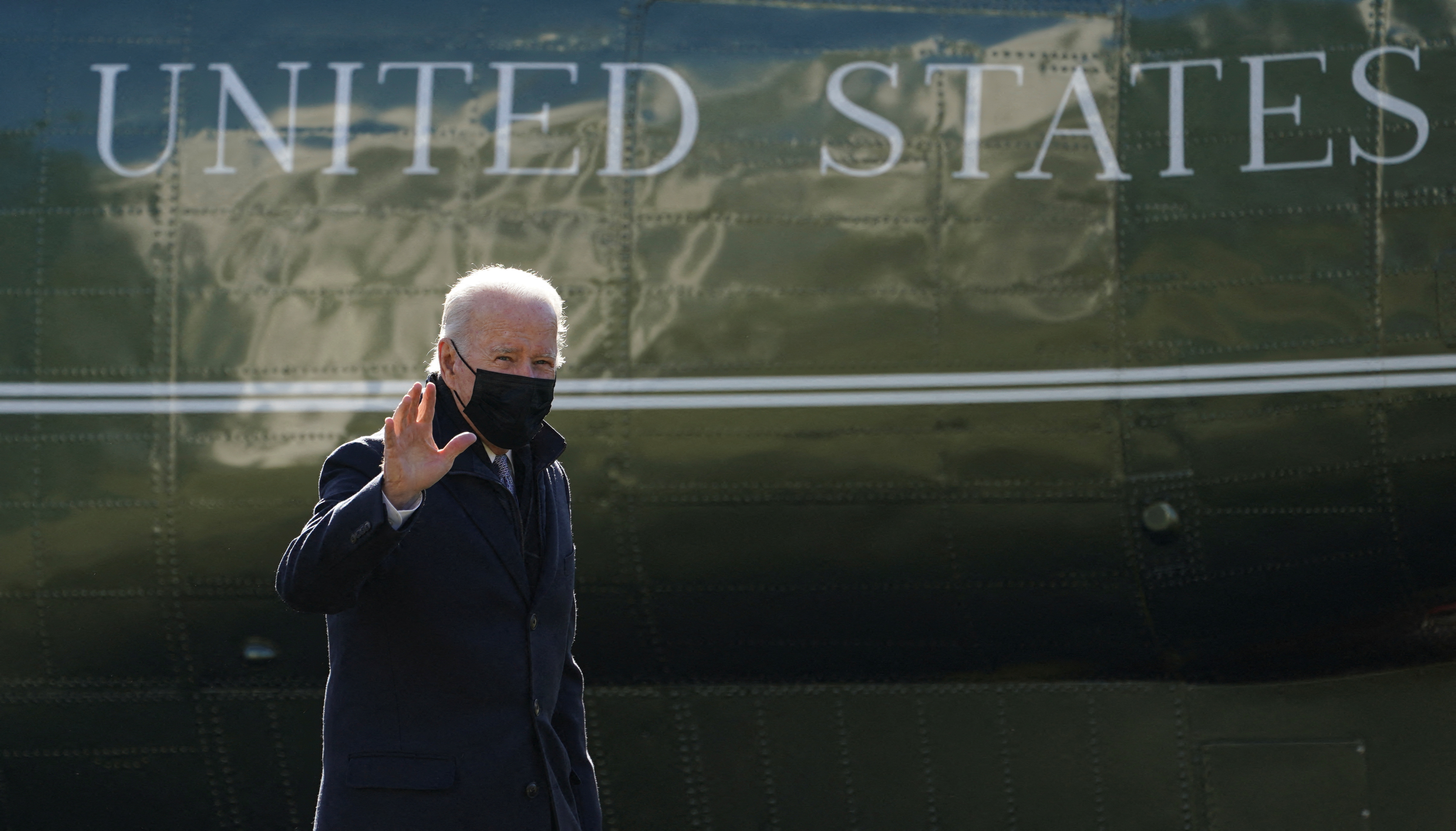 President Joe Biden waves as he returns via Marine One to the White House in Washington, D.C., Jan. 10, 2022.