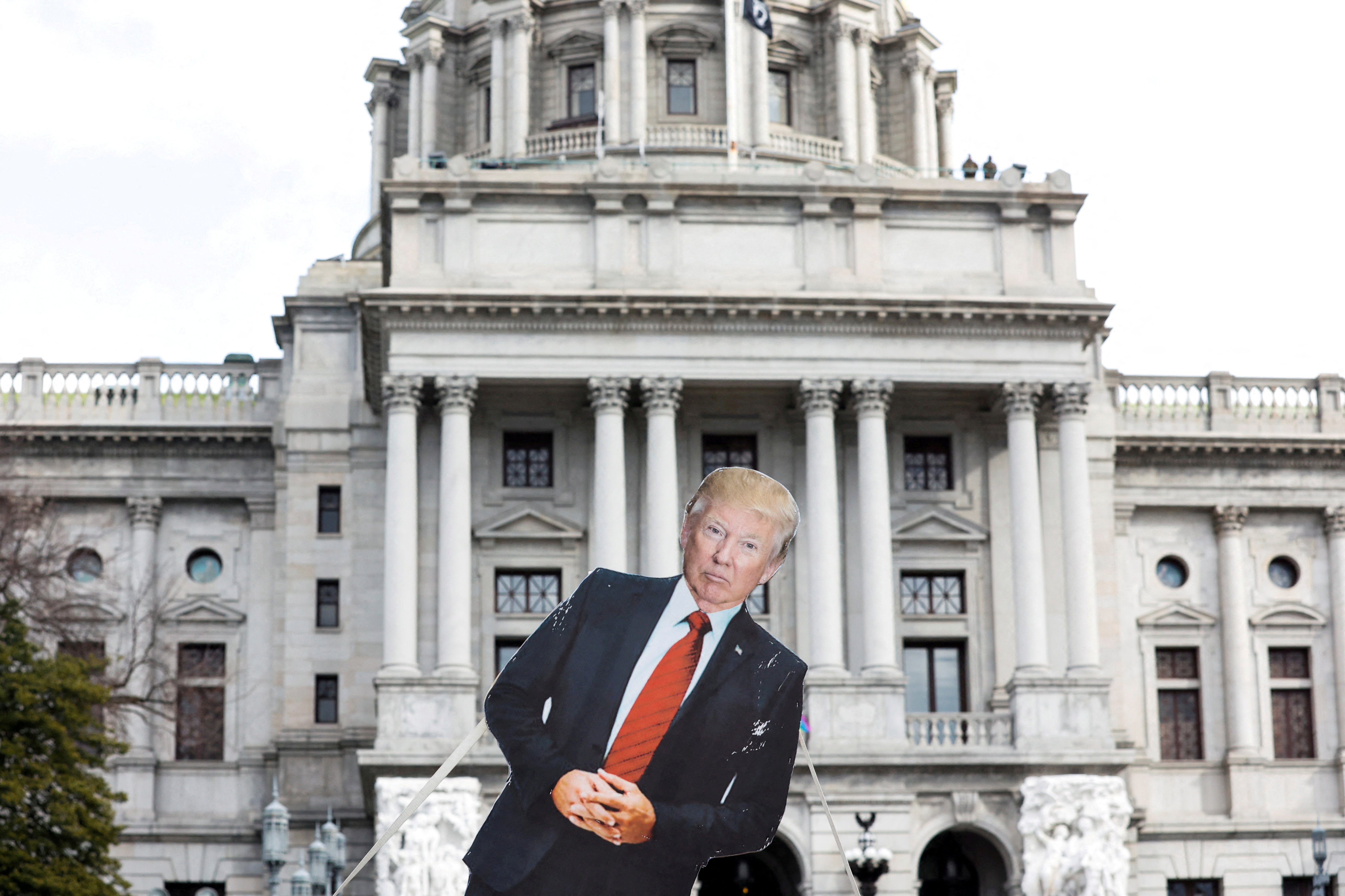 A cardboard cutout depicting President Donald Trump is seen in front of Pennsylvania State Capitol, as supporters of him are expected to protest against the election of President-elect Joe Biden, outside the Pennsylvania State Capitol in Harrisburg, Pennsylvania, on Jan. 17, 2021.