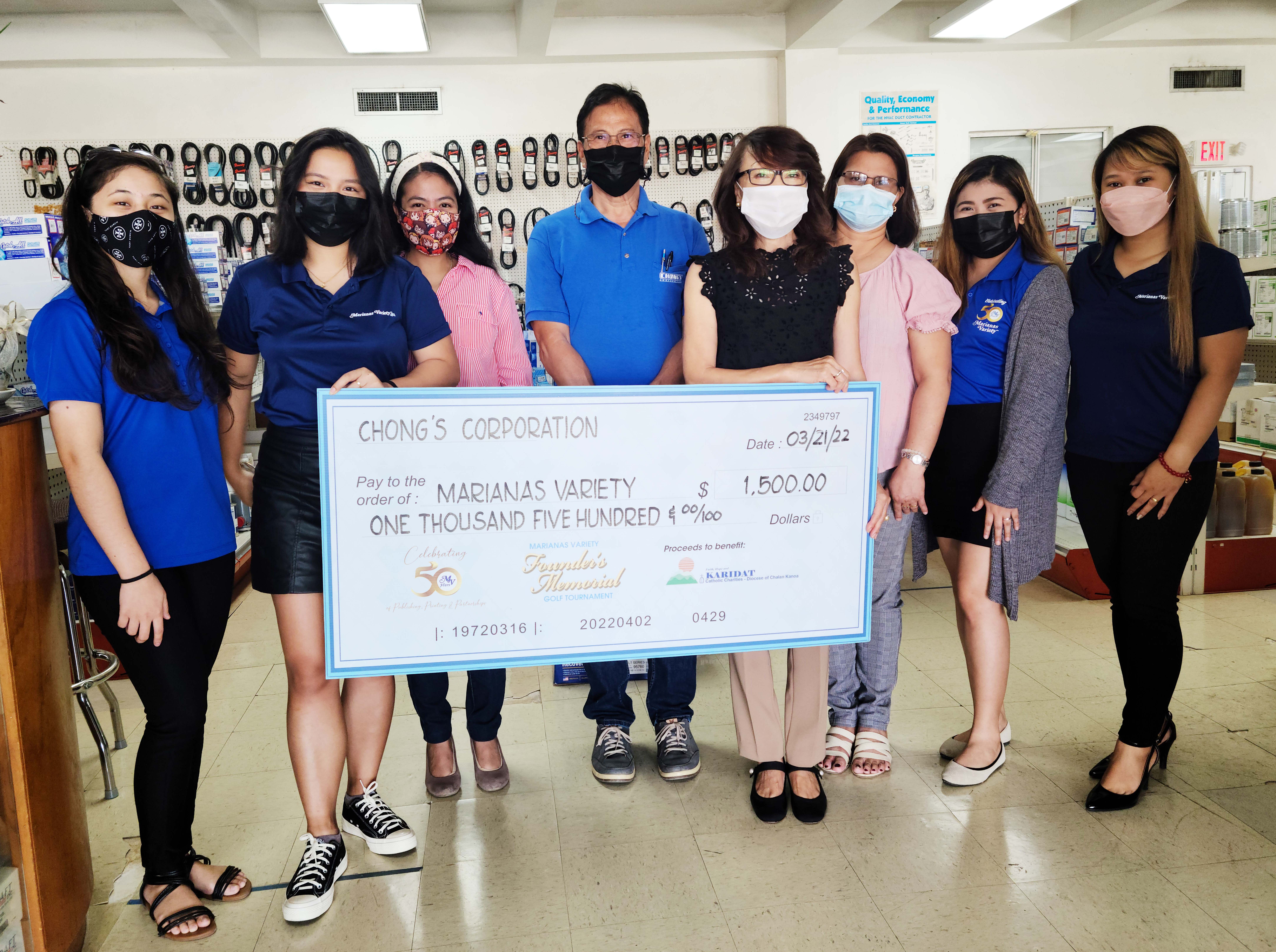 Chong's Corp. president Joanna Pai, fourth right, with staffers Camille Samonte, third left, Honesto Servida, center, and Rosal Nicdao pose for a photo with Marianas Variety sales representatives Monique Mascarinas, left, Hazel Sadian, second left, Gwendolyn Sandig, second right, and Diane Lumapas, right, during a presentation of a check for $1,500 that Chong Corp. donated to  the MV Founder's Memorial Golf Tournament which aims to raise funds for Karidat.