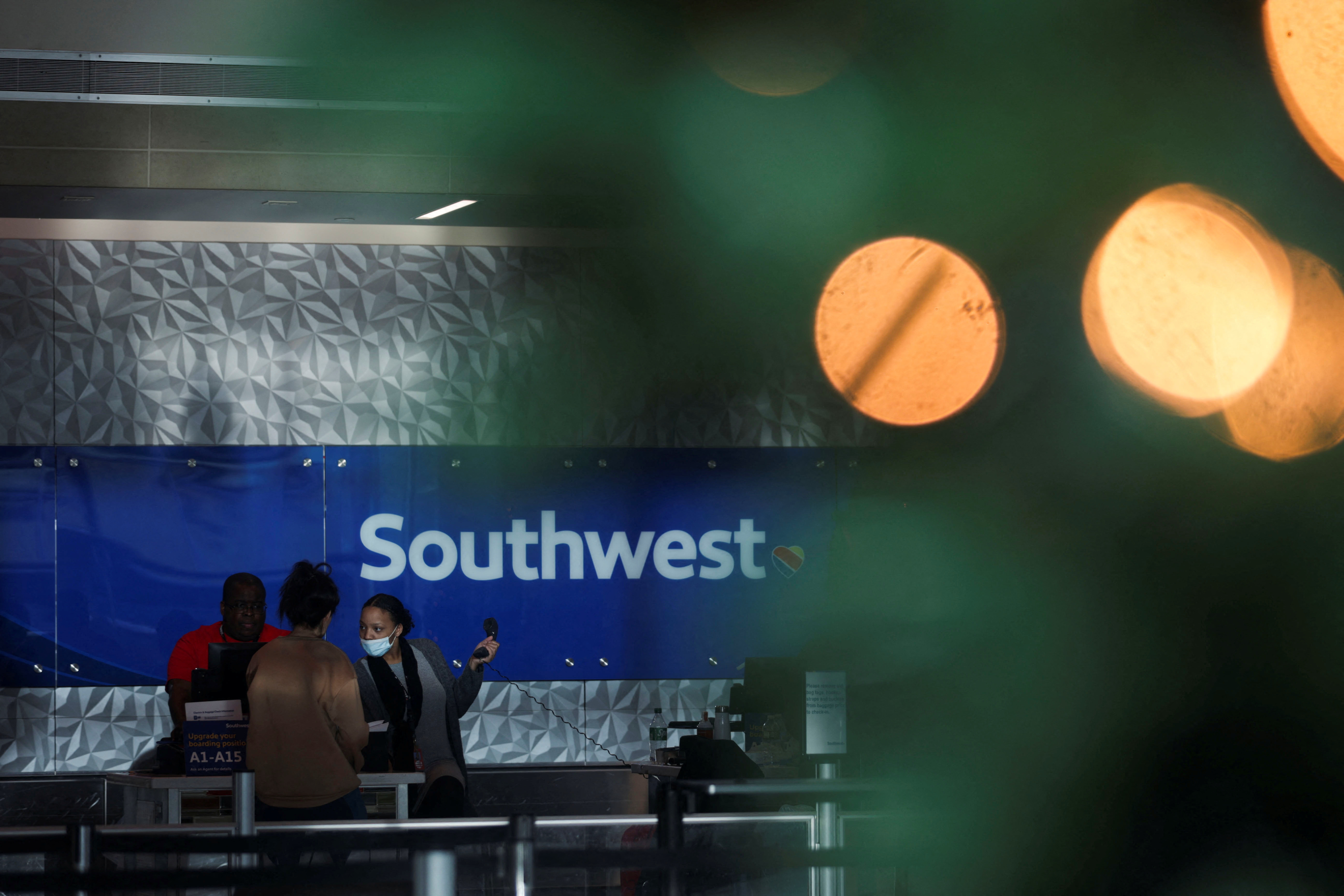Southwest customers visit the help desk after U.S. airlines, led by Southwest, canceled thousands of flights due to a massive winter storm which swept over much of the country before and during the Christmas holiday weekend, at Dallas Love Field Airport in Dallas, Texas, Dec. 28, 2022.