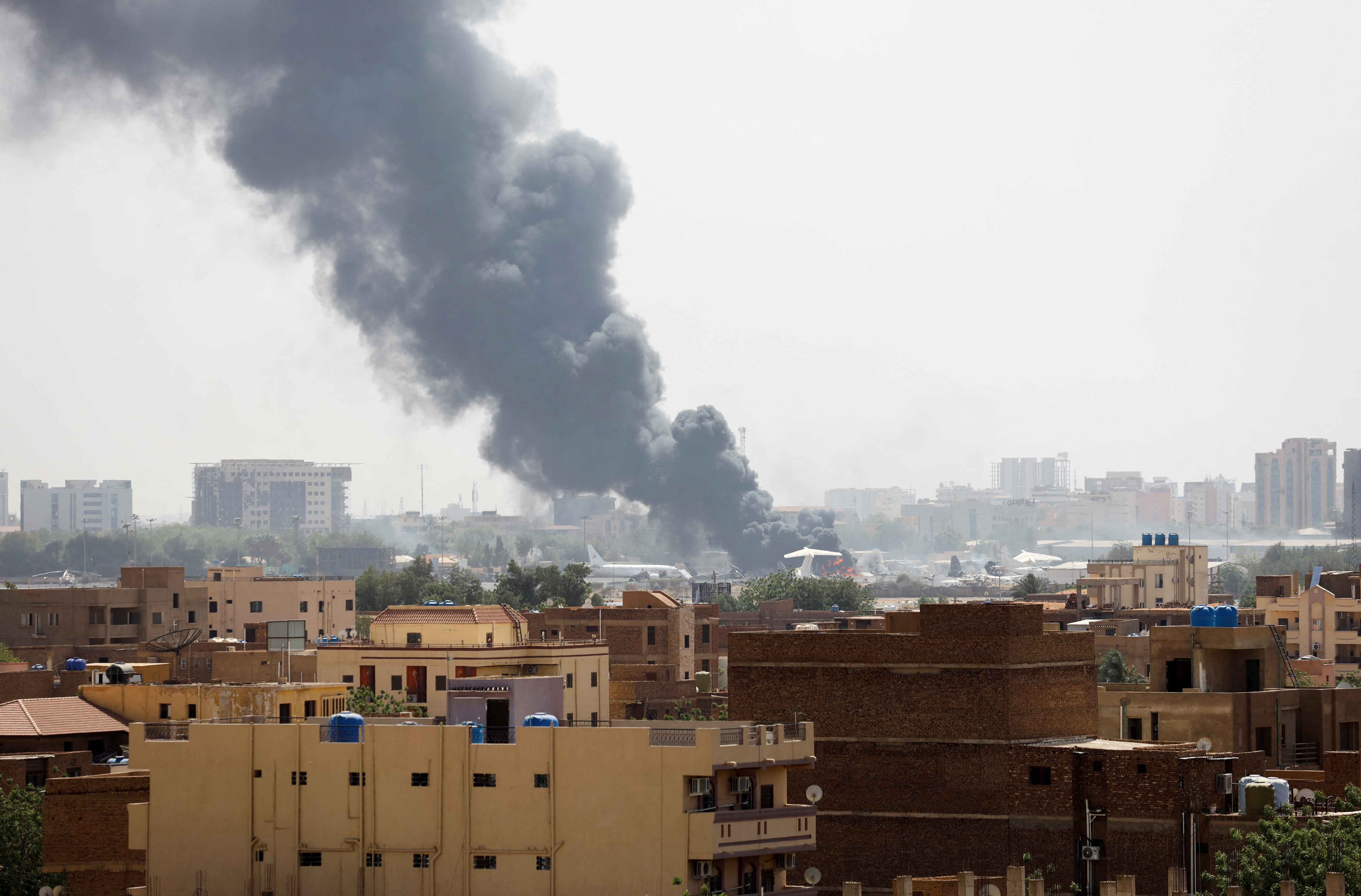 Smoke rises from burning aircraft inside Khartoum Airport during clashes between the paramilitary Rapid Support Forces and the army in Khartoum, Sudan April 17, 2023. REUTERS/Stringer