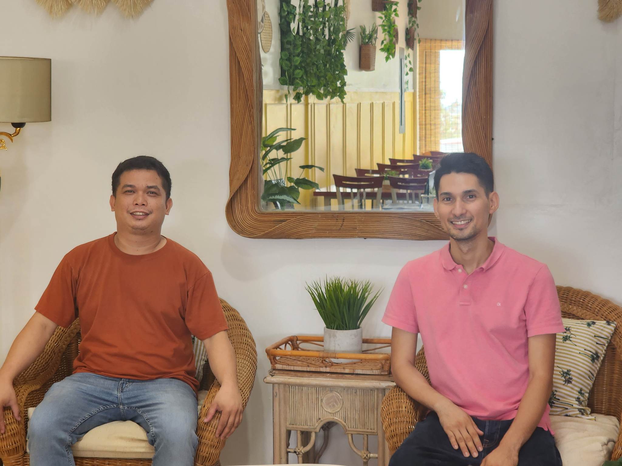 Citrine owners Rodolfo Catindig, left, and John Such pose in one of the cozy corners of their café.