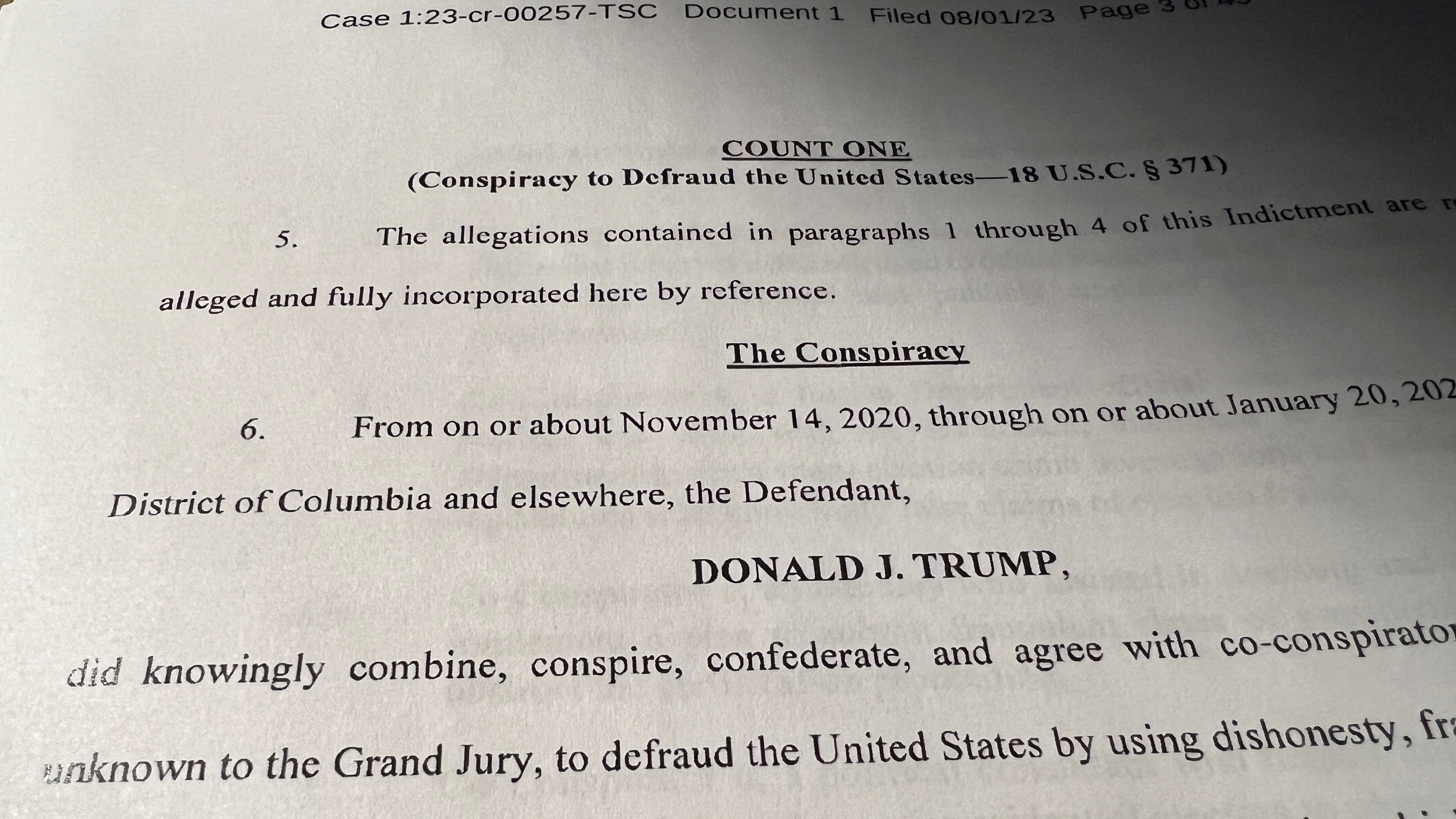 Count One "Conspiracy to Defraud the United States," of an indictment against former U.S. President Donald Trump, is seen after he was hit with criminal charges for a third time in four months - this time arising from efforts to overturn his 2020 U.S. election defeat, in a photo illustration August 1, 2023. REUTERS/Kevin Fogarty/Photo Illustration