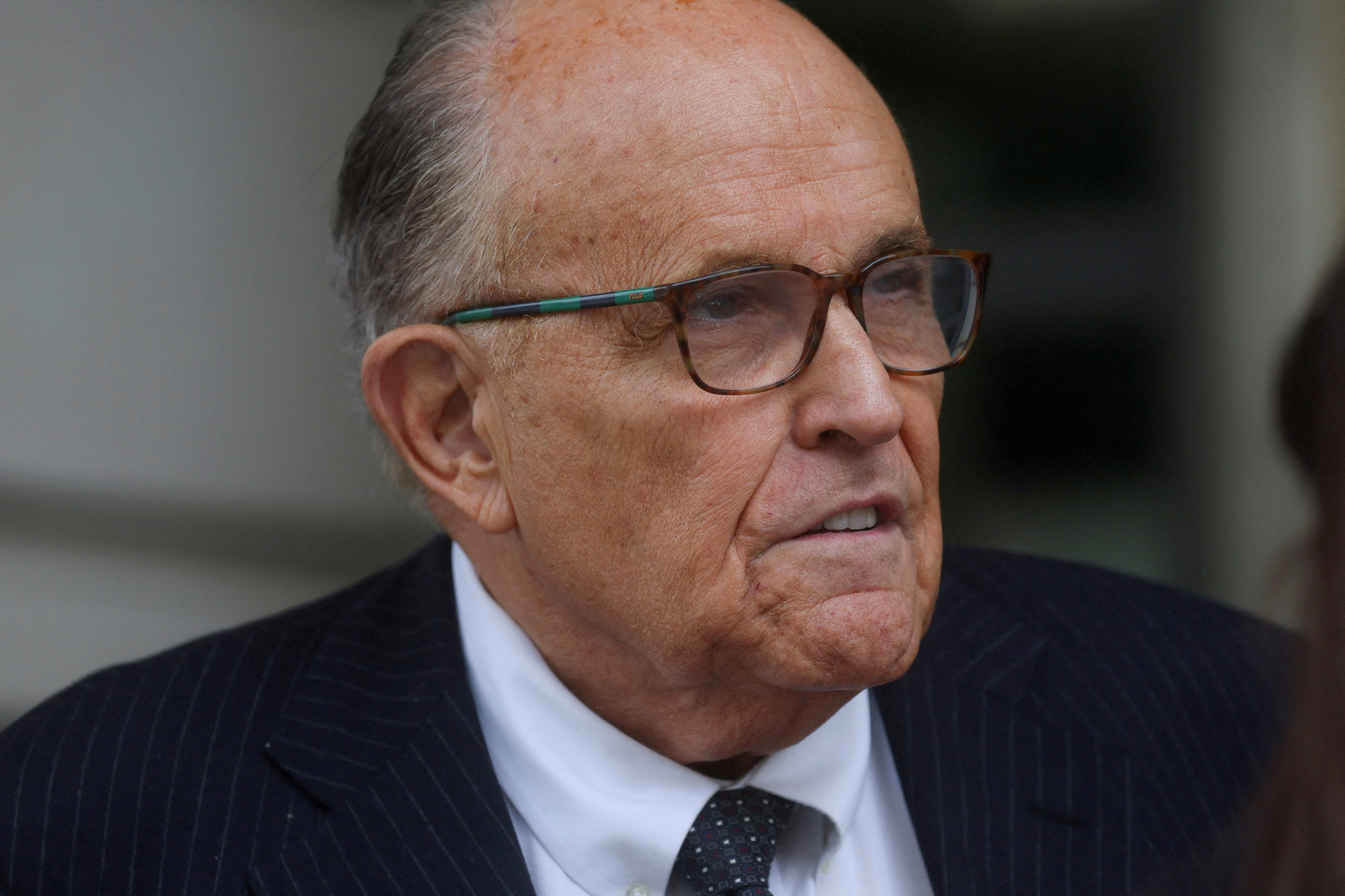 FILE PHOTO: Former New York City Mayor Rudy Giuliani, an attorney for former U.S. President Donald Trump during challenges to the 2020 election results, exits U.S. District Court after attending a hearing in a defamation suit related to the 2020 election results that has been brought against Giuliani by two Georgia election workers, at the federal courthouse in Washington, U.S., May 19, 2023. REUTERS/Leah Millis