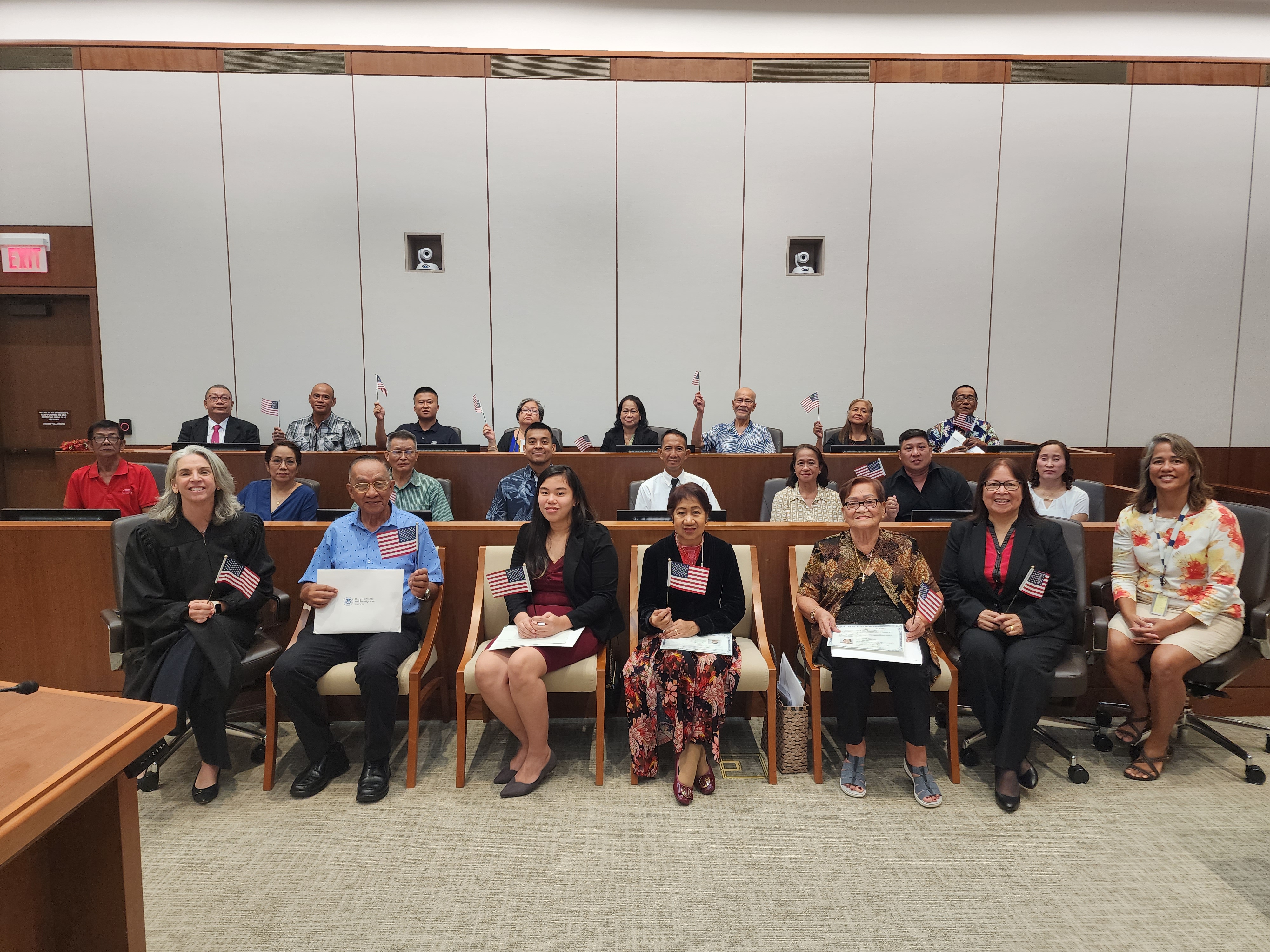 Twenty new U.S. citizens were sworn in during a naturalization ceremony at the District Court for the NMI on Monday. Also in photo are Magistrate Judge Heather Kennedy, former Education Commissioner Dr. Rita A. Sablan, and USCIS Officer Christine Cepeda.