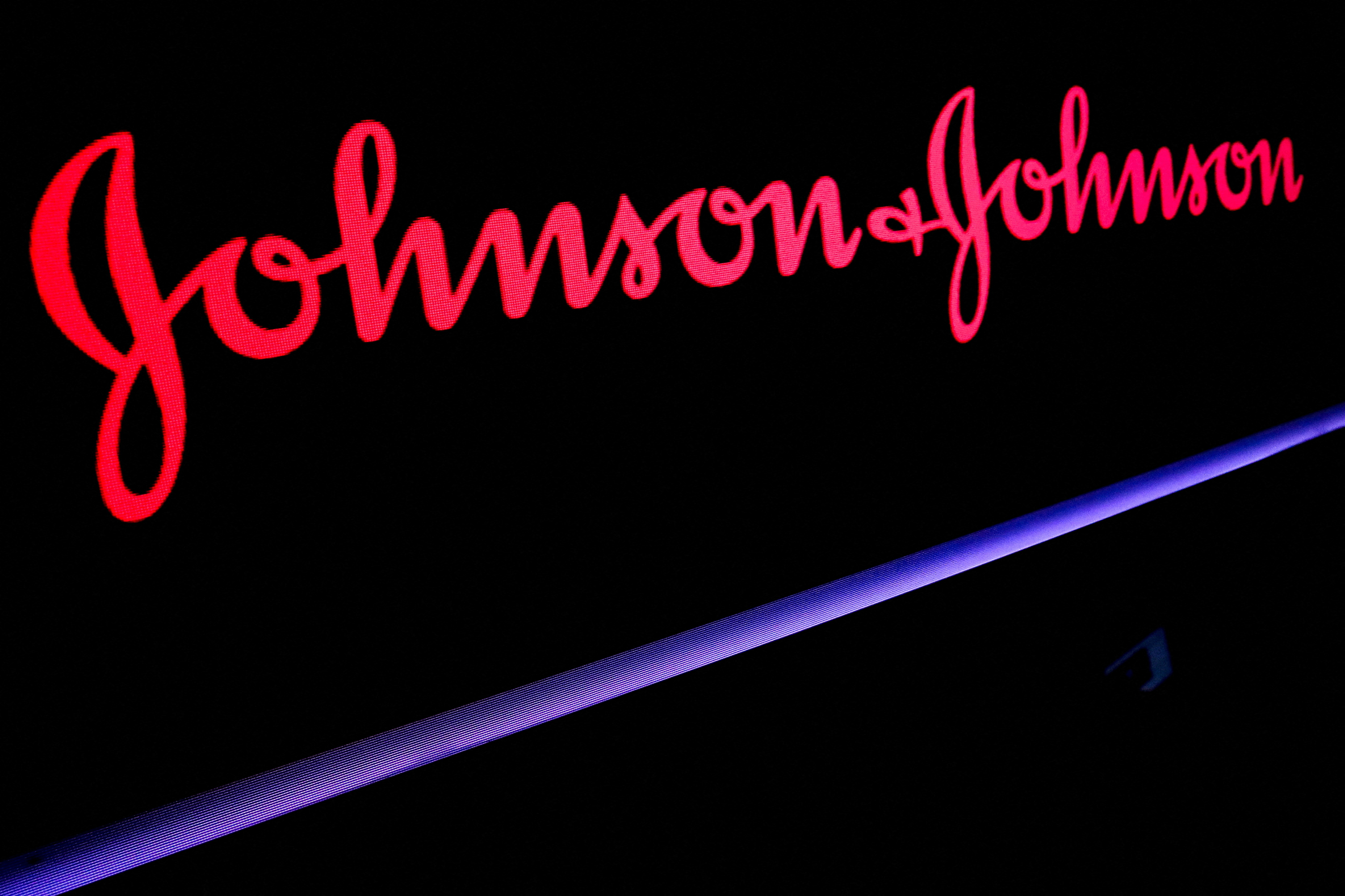 The Johnson & Johnson logo is displayed on a screen on the floor of the New York Stock Exchange (NYSE) in New York, U.S., May 29, 2019. REUTERS/Brendan McDermid/File Photo/File Photo