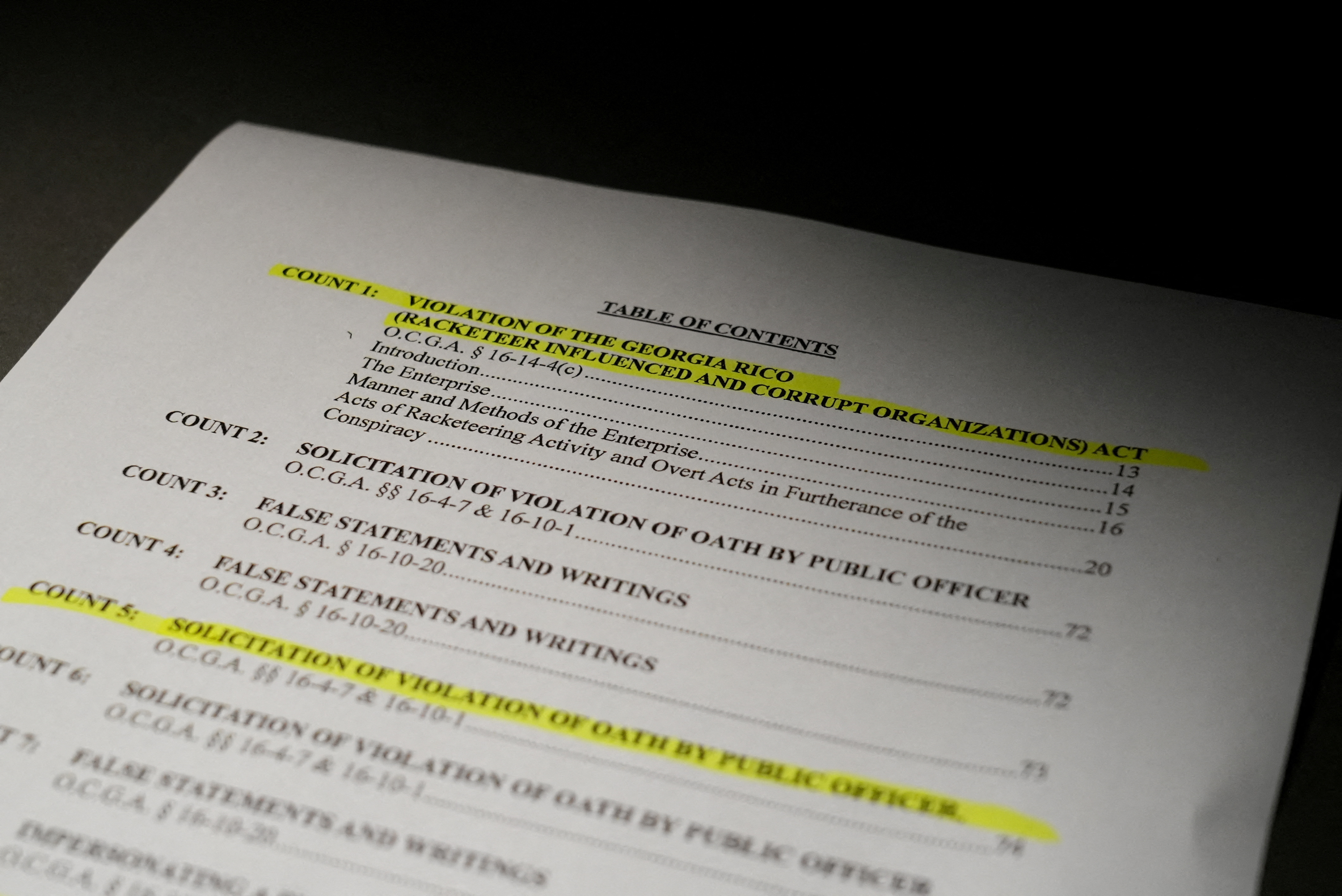 A view of the indictment, after a Georgia grand jury voted to indict former president Donald Trump with several felonies late Monday night in the case investigating attempts to overturn the results of the 2020 presidential election, is pictured at the Reuters Washington office, D.C., U.S. August 14, 2023. REUTERS/Julio-Cesar Chavez
