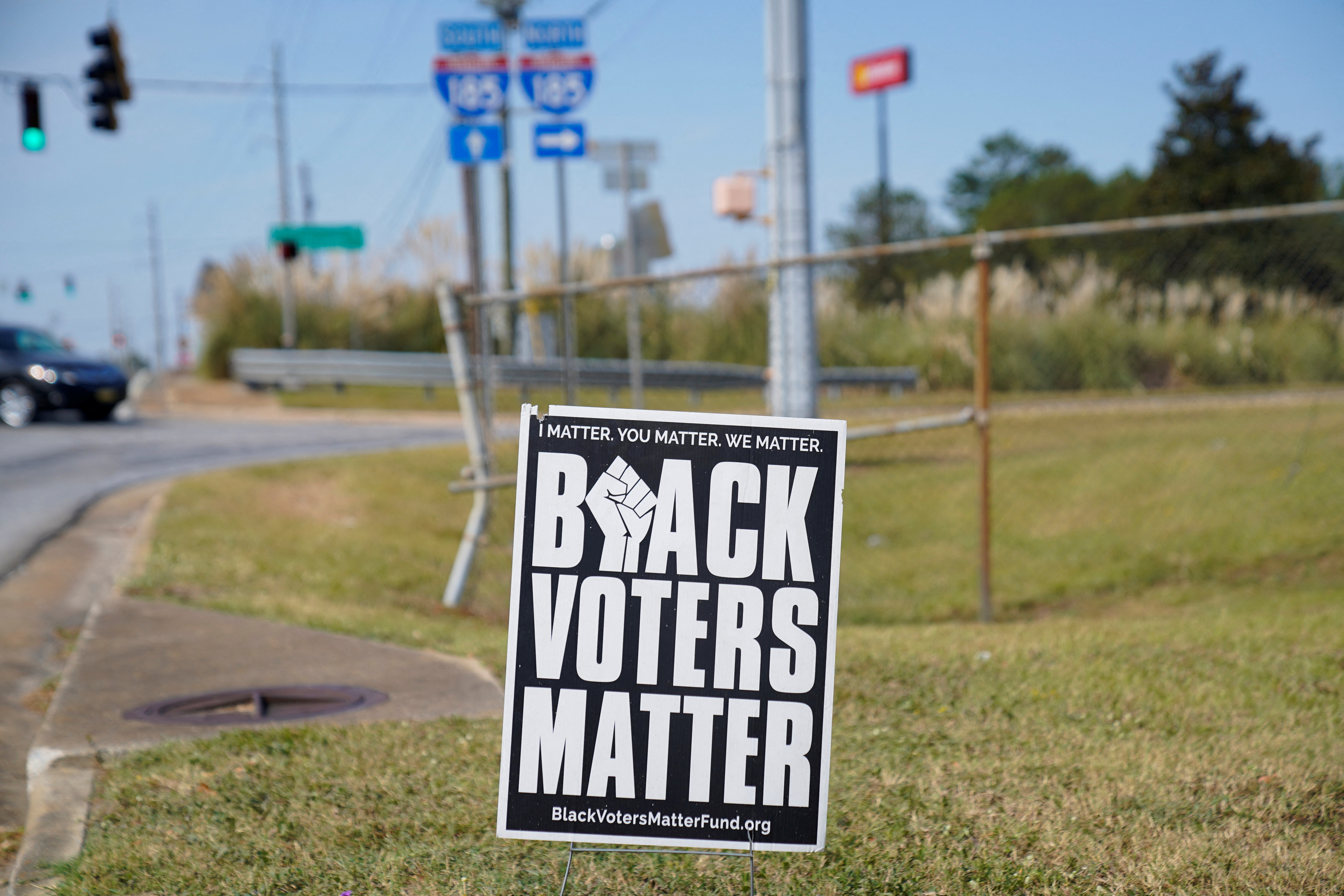 A sign reading 'black voters matter' stands on a roadside as early voting begins for the midterm elections in Columbus, Georgia, U.S., October 17, 2022. REUTERS/Cheney Orr