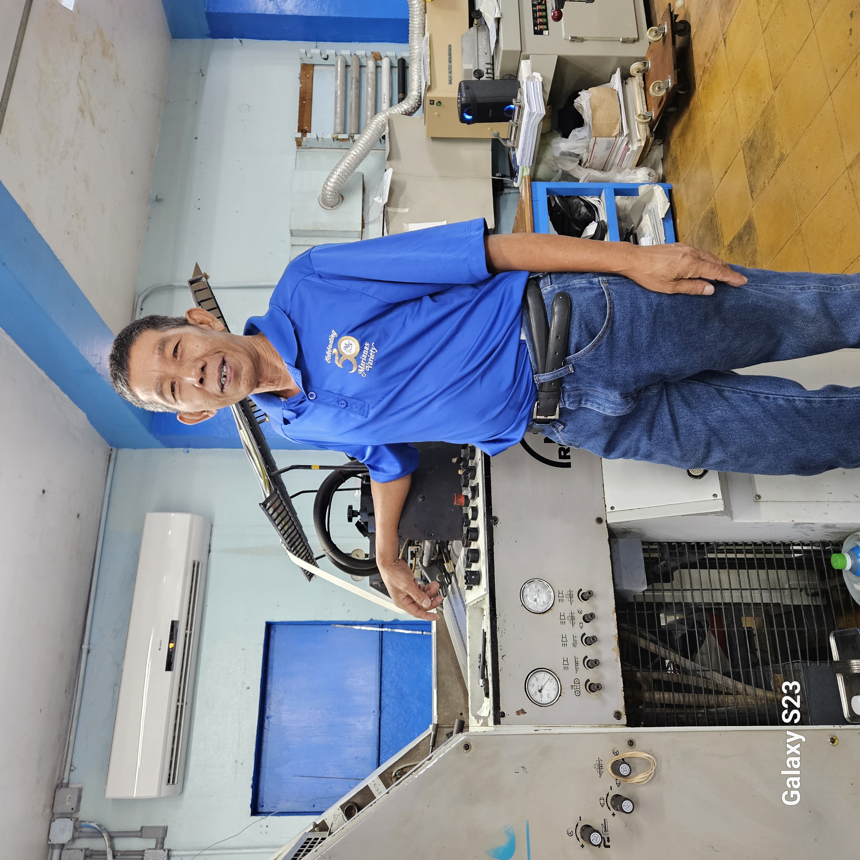 "Kuya Arsen" poses with one of the machines he operates at Mvariety on August 31, 2023. 