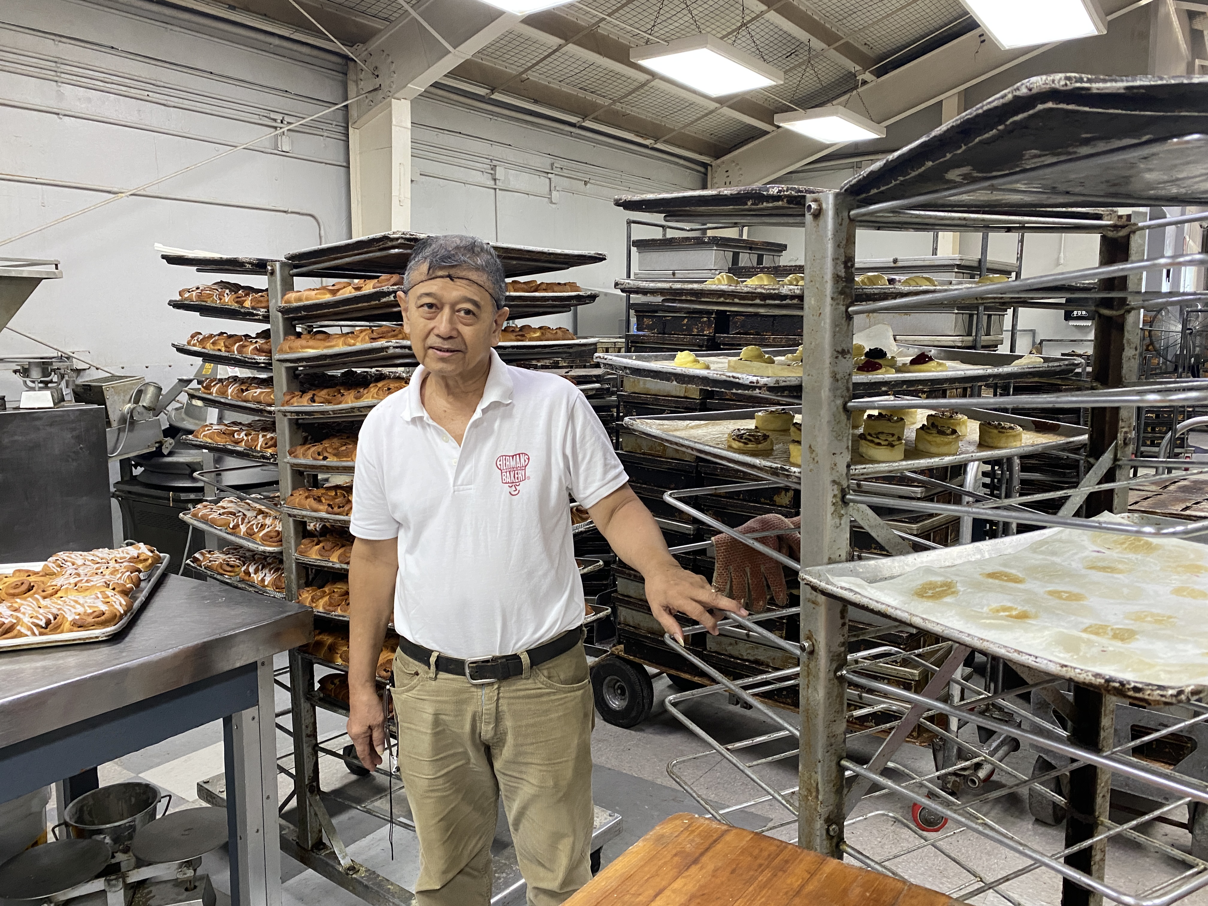 Ernie Lineses poses inside the commercial bakery where he made his career. 