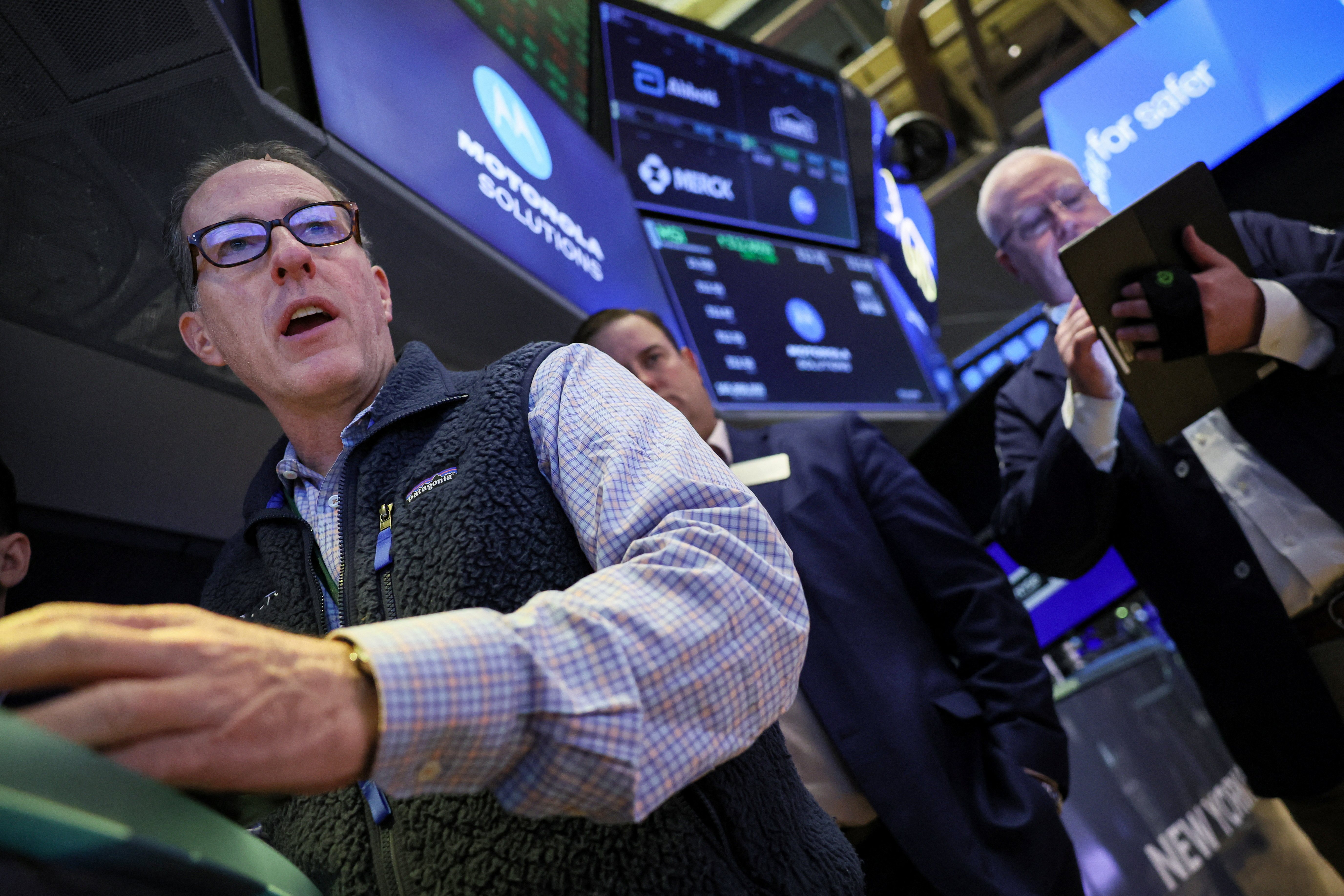 Traders work on the floor at the New York Stock Exchange (NYSE) in New York City, U.S., November 15, 2023. 
