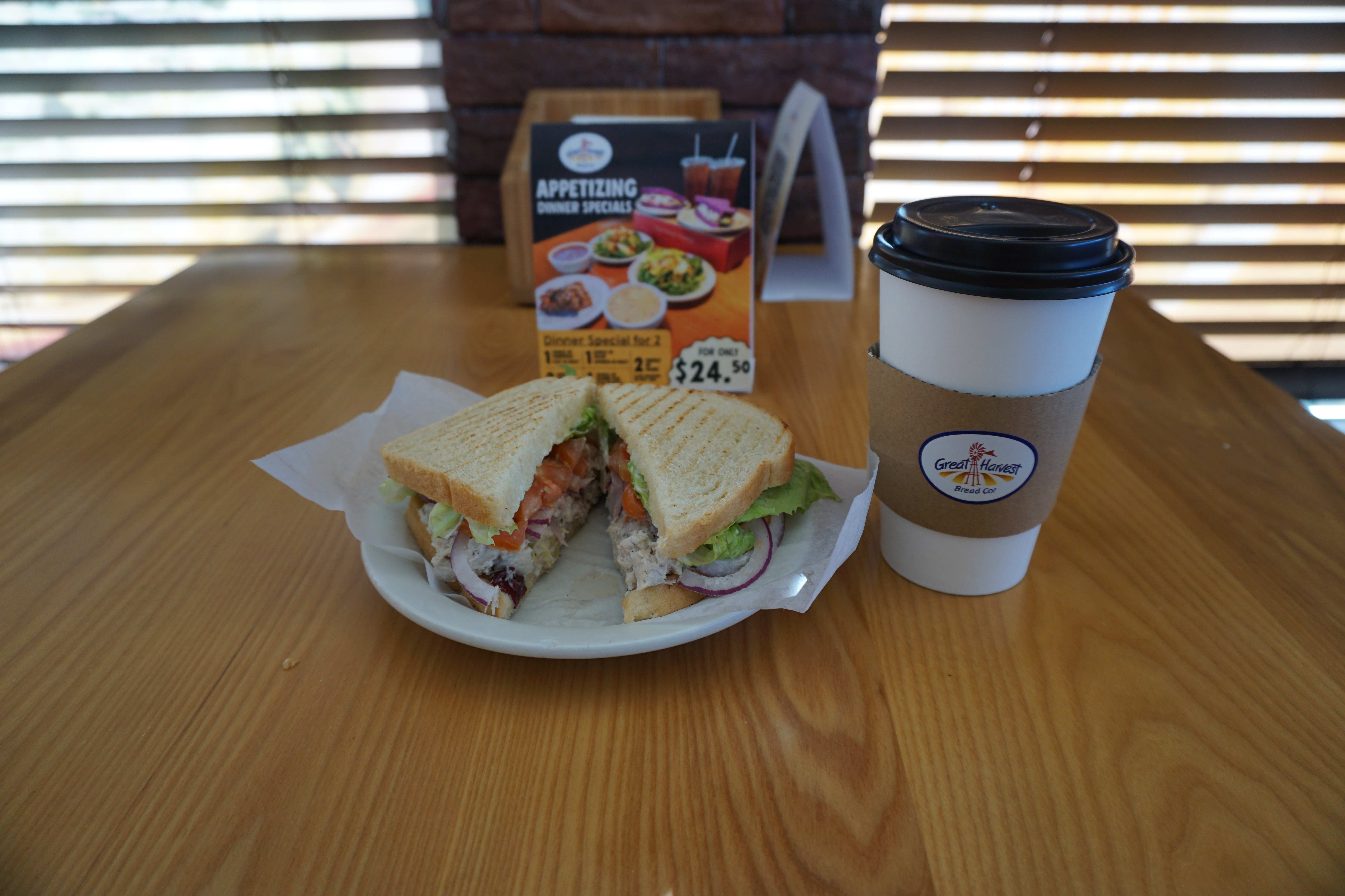 One of the top sellers at Great Harvest Bread Company--the Big Sky Chicken Salad Sandwich. White meat chicken, cranberries, artichoke hearts, herbs, lemon, walnuts, lettuce, tomato, onion, and mayonnaise.
