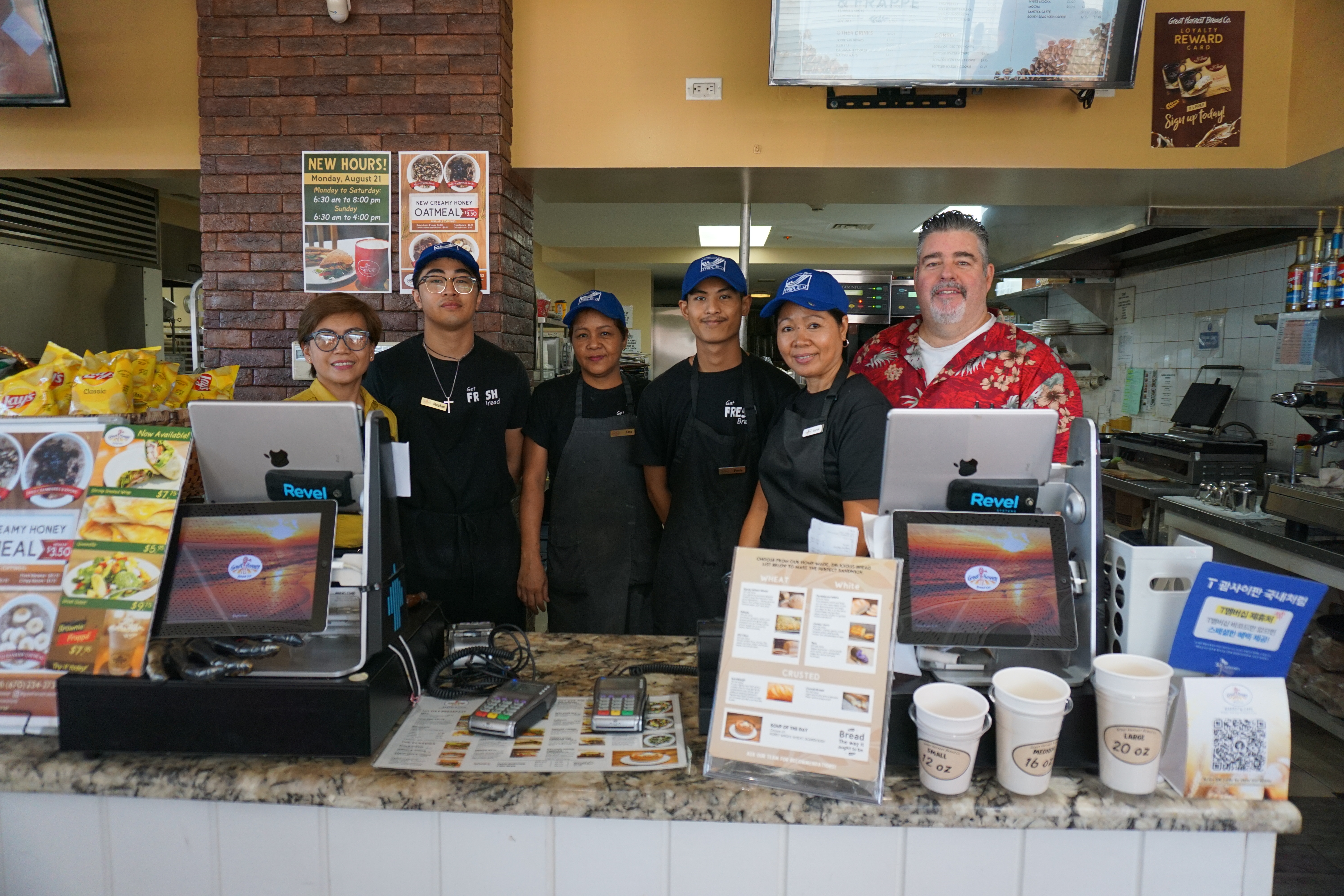 The staff of Great Harvest Bread Company pose with Carol Lucenara, far left, and Rocco Valentino, far right. 