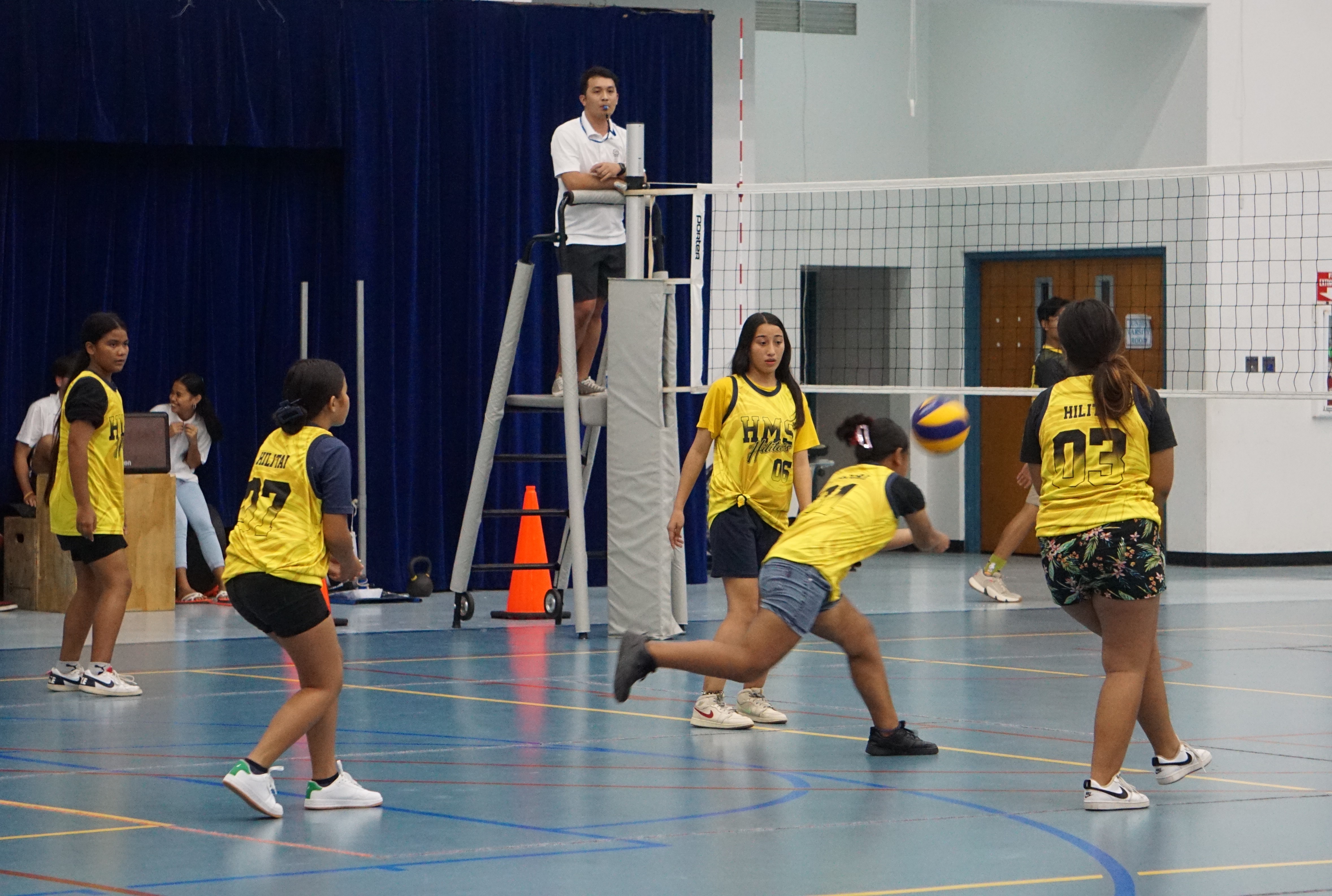 A Hopwood Middle School II player reaches out for the save as her teammates look on during a girls middle school division game of the NMIVA-PSS Interscholastic Volleyball League SY23-24 at the Marianas High School gym. 