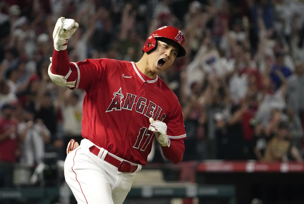 Los Angeles Angels’ Shohei Ohtani celebrates as he rounds first after hitting a two-run home run during the seventh inning of a baseball game against the New York Yankees on July 17, 2023 in Anaheim, Calif.