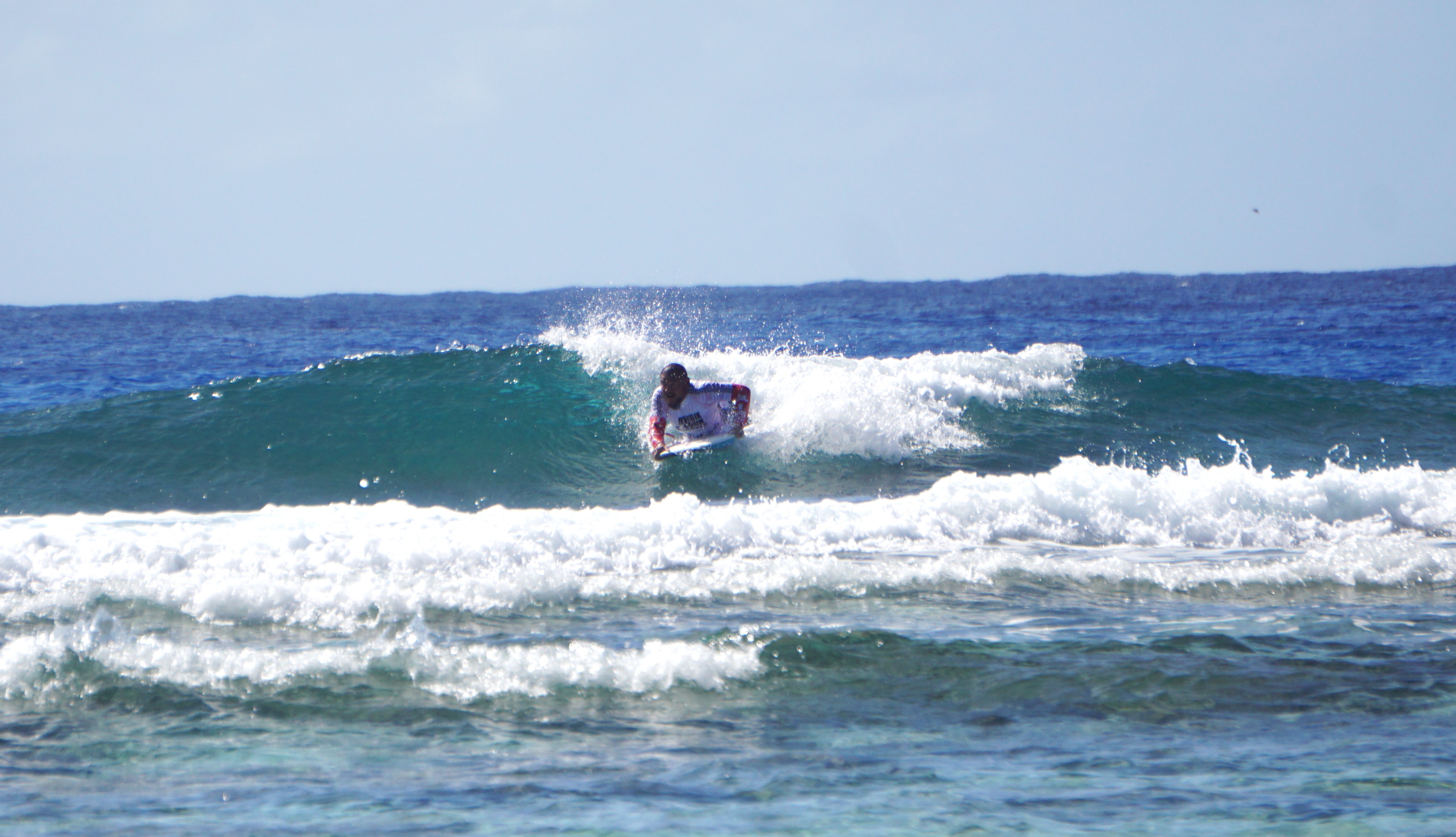 Solomon Castro steers inwards the tube of an incoming wave. 