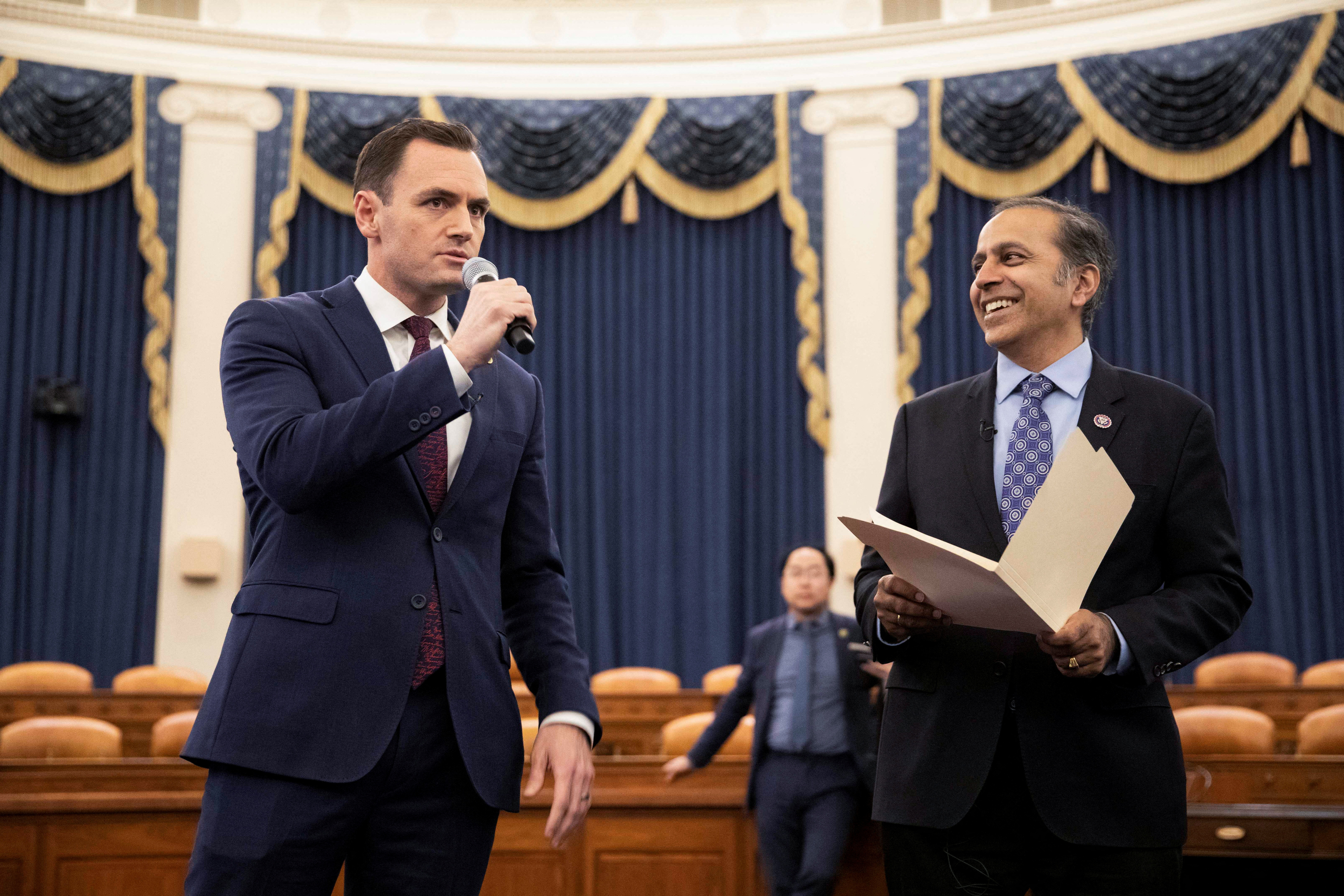 Committee chairman U.S. Rep. Mike Gallagher (R-WI) and U.S. Rep. Raja Krishnamoorthi (D-IL) talk over procedures with their members during a House Select Committee on the Strategic Competition Between the United States and the Chinese Communist Party meeting on "Taiwan Tabletop Exercise (TTX)," a war games simulation, on Capitol Hill in Washington, U.S., April 19, 2023. 