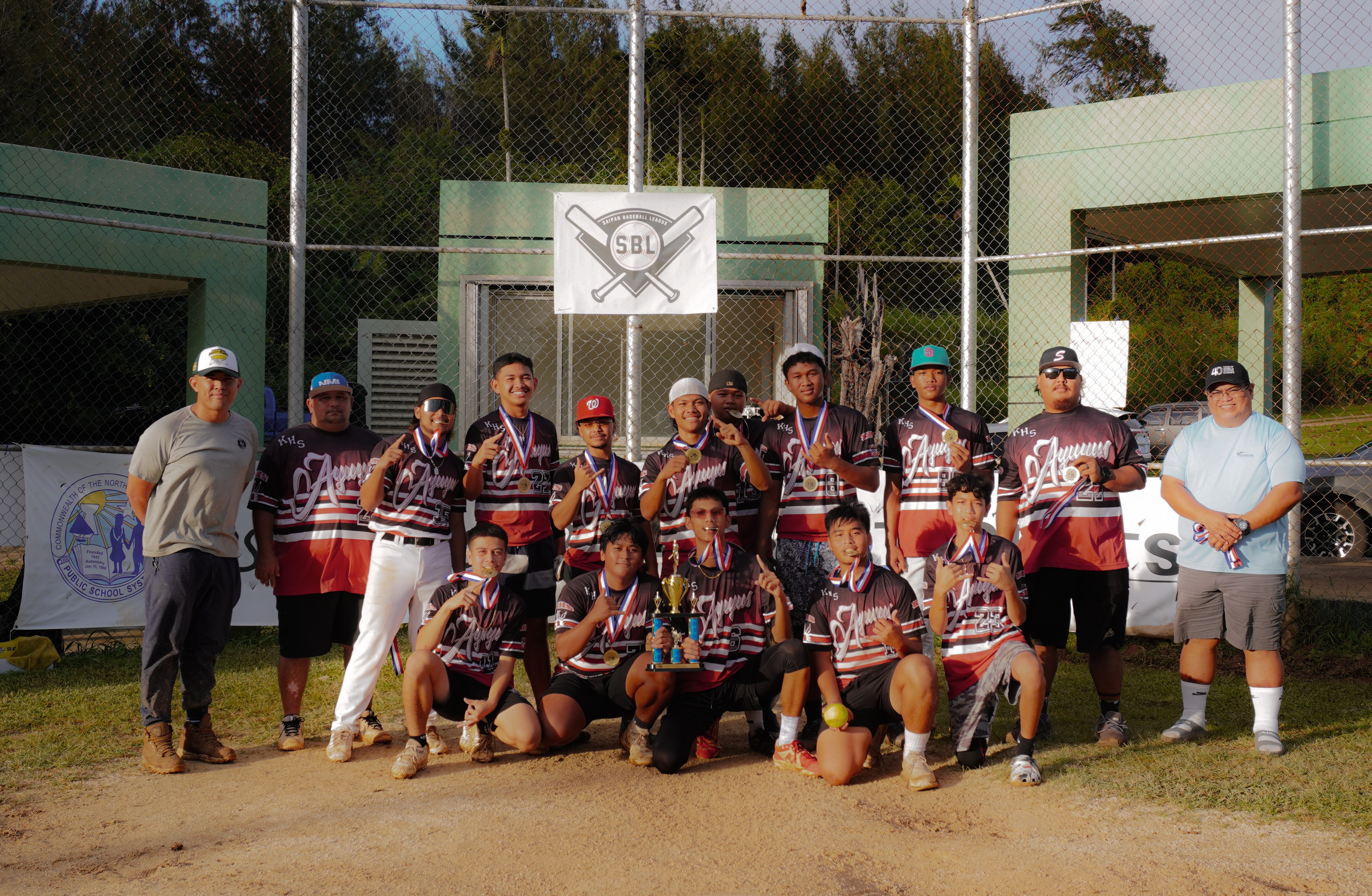 Kagman High School team members pose for a photo after winning the boys high school division championship of the PSS-SBL Interscholastic Softball League SY23-24 on Saturday at the Capital Hill baseball field.
