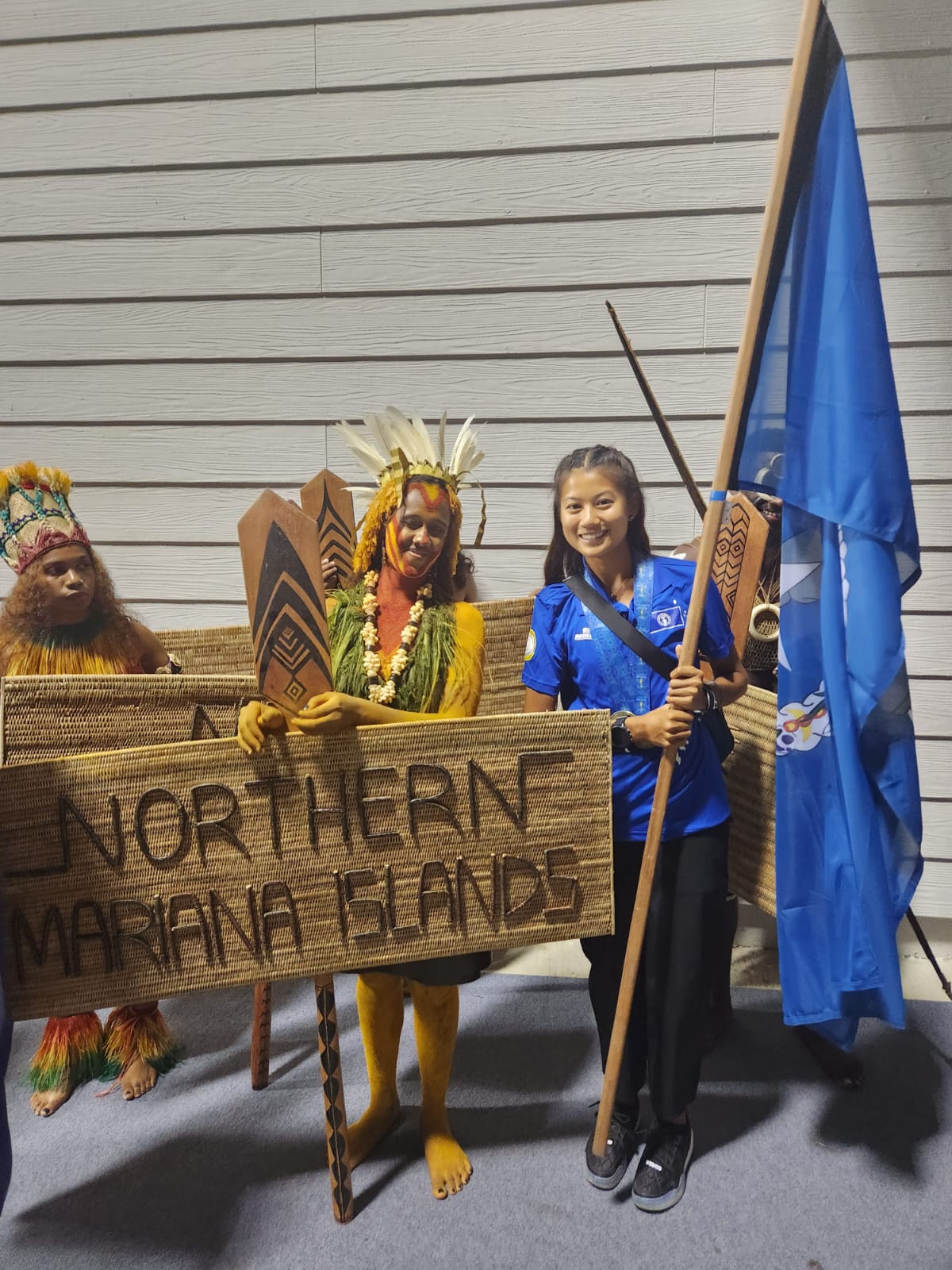 NMI flag bearer Tania Tan gets ready for start of the closing ceremonies of the 2023 Pacific Games in Honiara, the Solomon Islands on Saturday night.