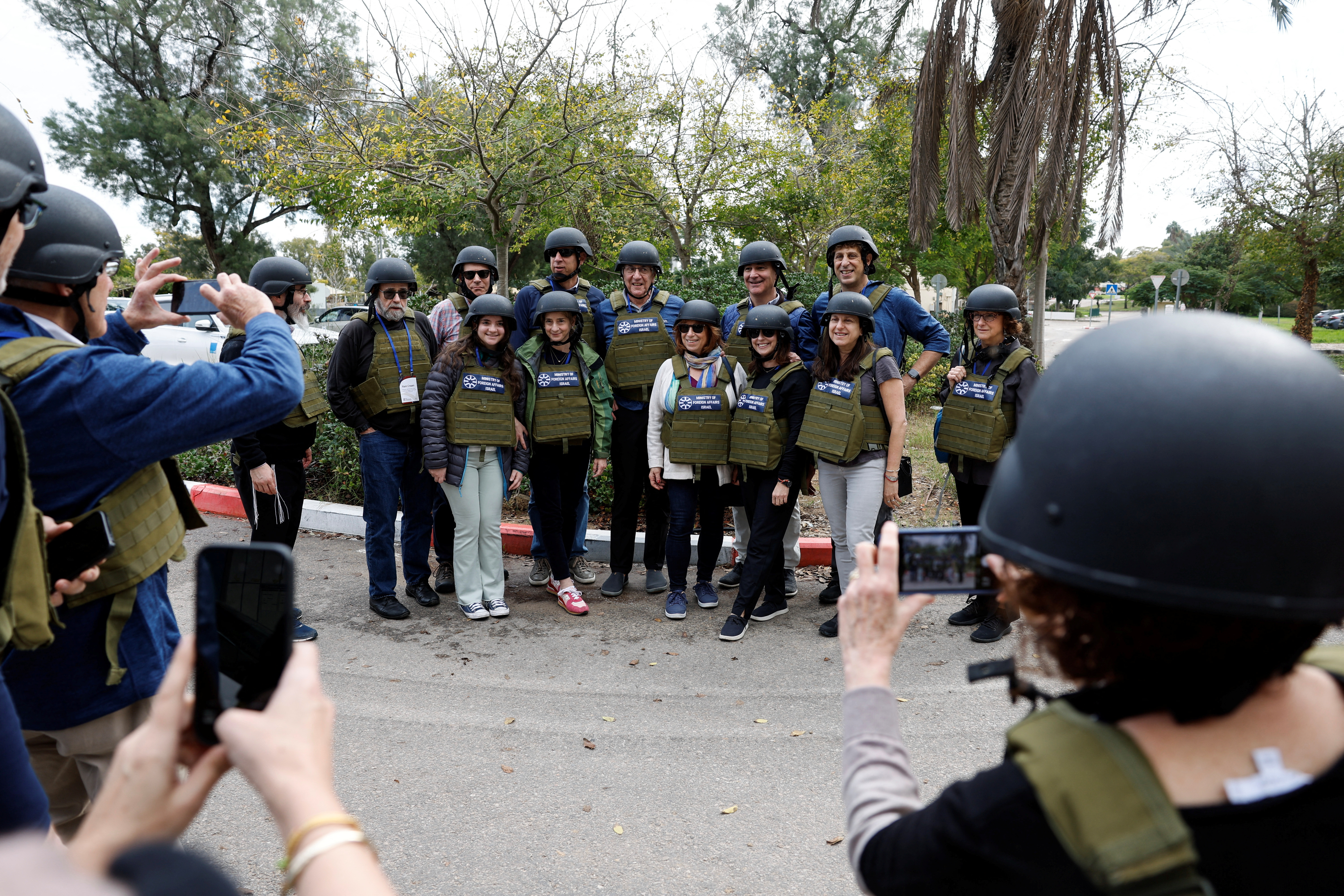 Faculty and representatives from the University of Pennsylvania pose for a group photo during a tour of Kibbutz Kfar Aza, following the deadly October 7 attack by Palestinian Islamist group Hamas, in southern Israel January 3, 2024.