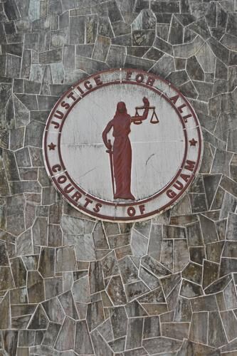 A "Justice For All" plaque is seen Monday, Feb. 12, 2024, on the old Superior Court Building at the Guam Judicial Center in Hagåtña. 