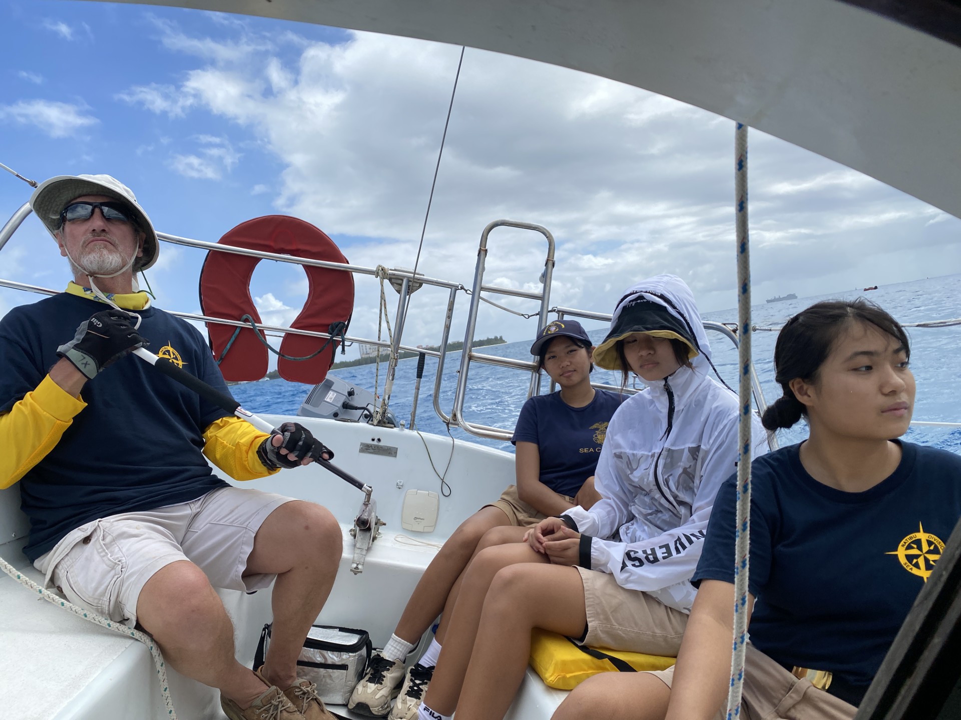 Capt. Michael Bacher with Sea Cadets Mary Wang, Hedy Fu and Jessica Ma aboard a monohull boat at the Saipan Lagoon on Sunday, April 14.