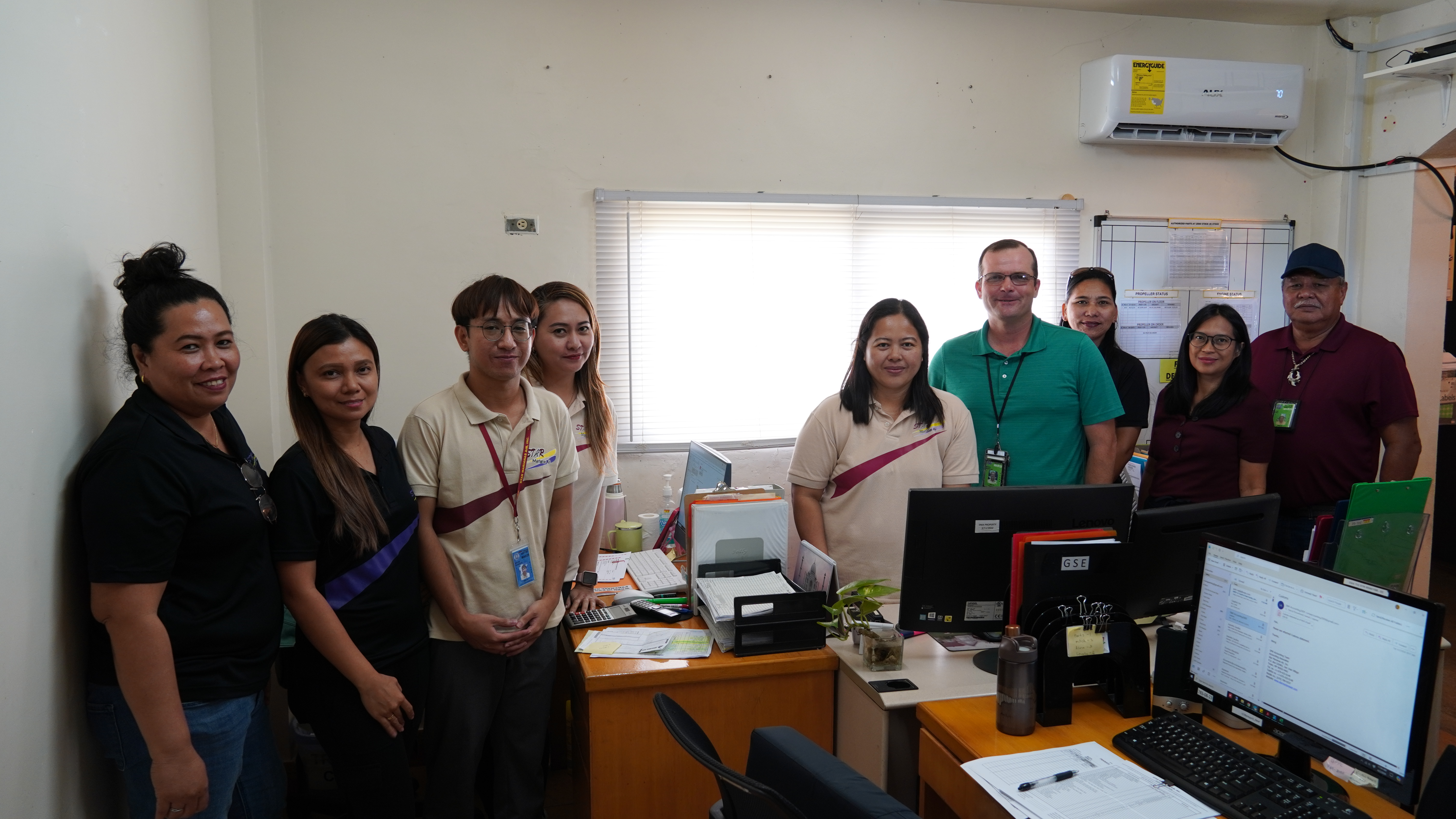 Shaun Christian (in green shirt) with the SMA's Procurement and Admin Department