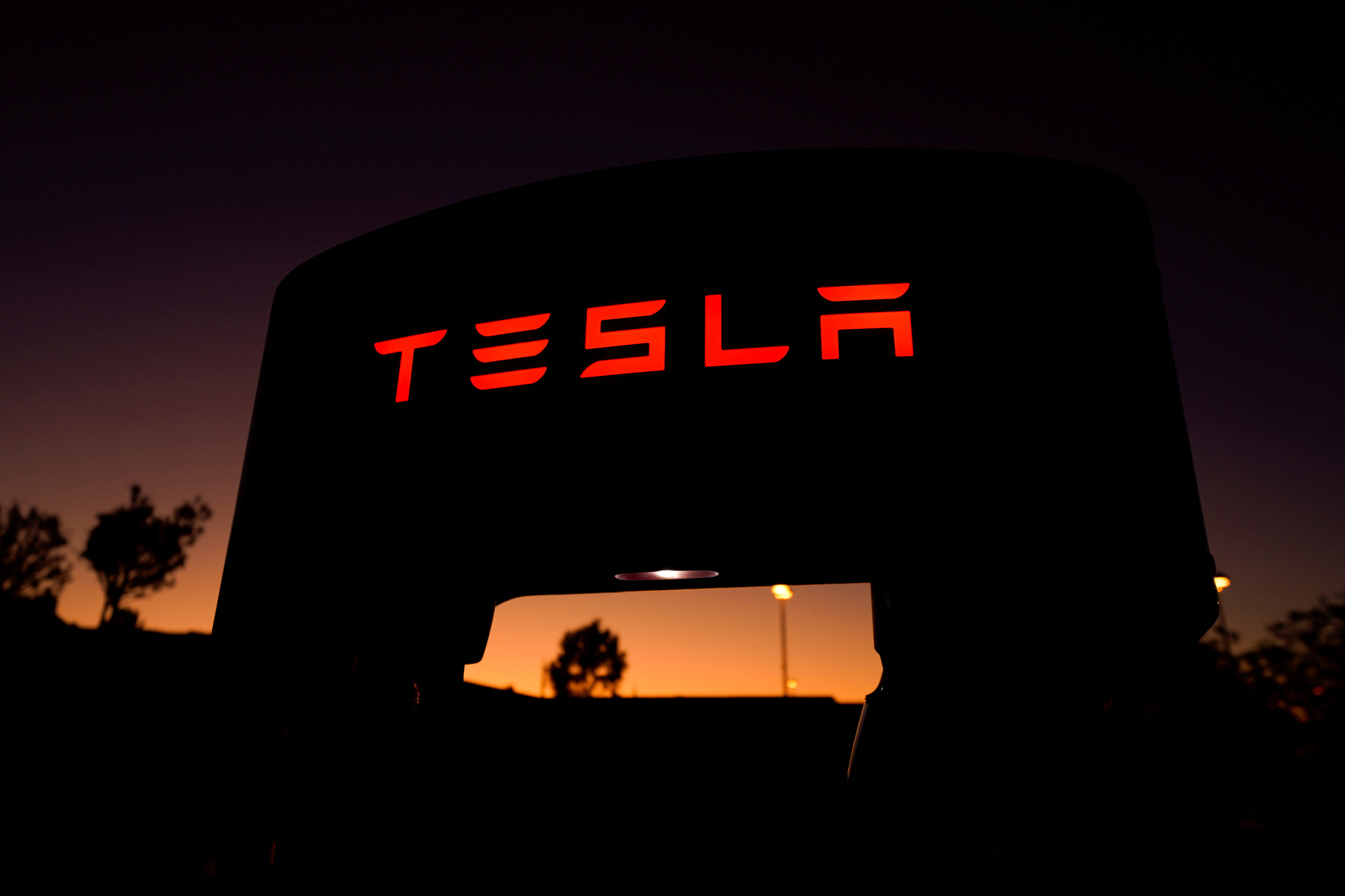 FILE PHOTO: A Tesla supercharger is shown at a charging station in Santa Clarita, California, U.S. October 2, 2019. 