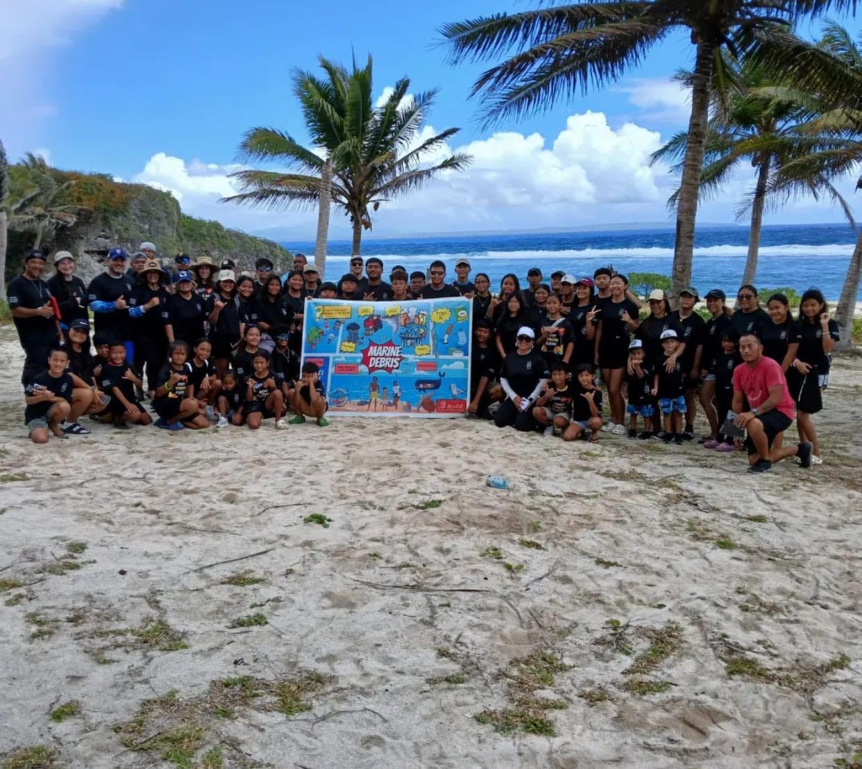 The team of Latte Marine Diving and Salvage take a pose after the Tinian Long Beach and Masalok Beach Clean-Up last April 6, 2024.
