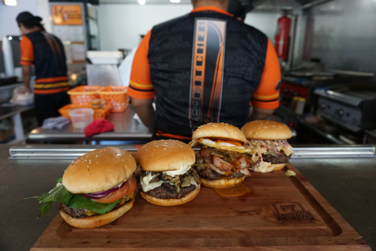 Four hot, fresh, and juicy burgers are ready for you at Inas’ Kitchen in Sadog Tasi​. From left to right are the house burger, a Swiss Burger, the Kaksaka Burger, and the Pika Burger.