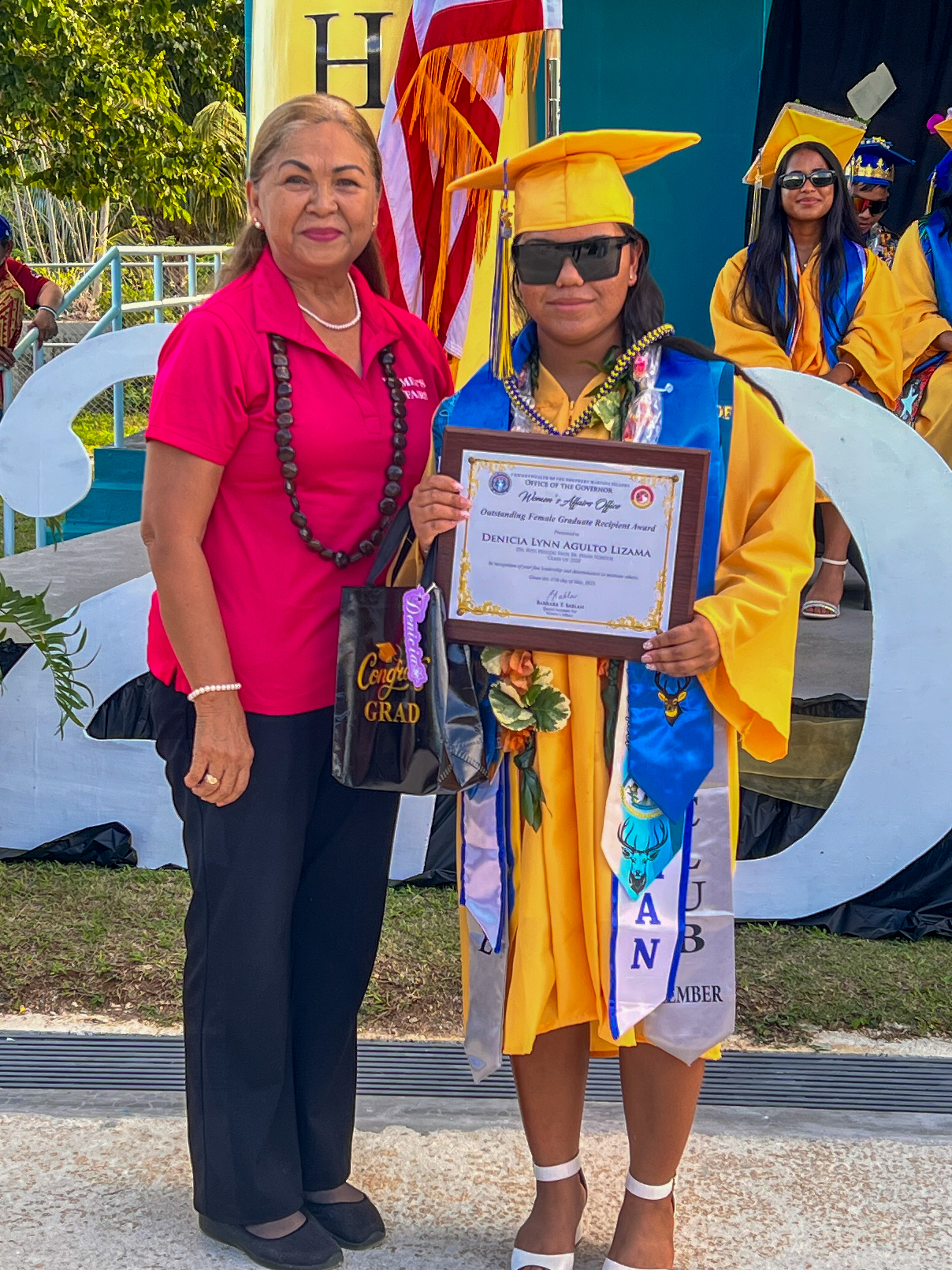 The Outstanding Female Graduate Award was presented to Denicia Lynn Agulto Lizama by Barbara Sablan, the governor’s special assistant for women’s affairs.