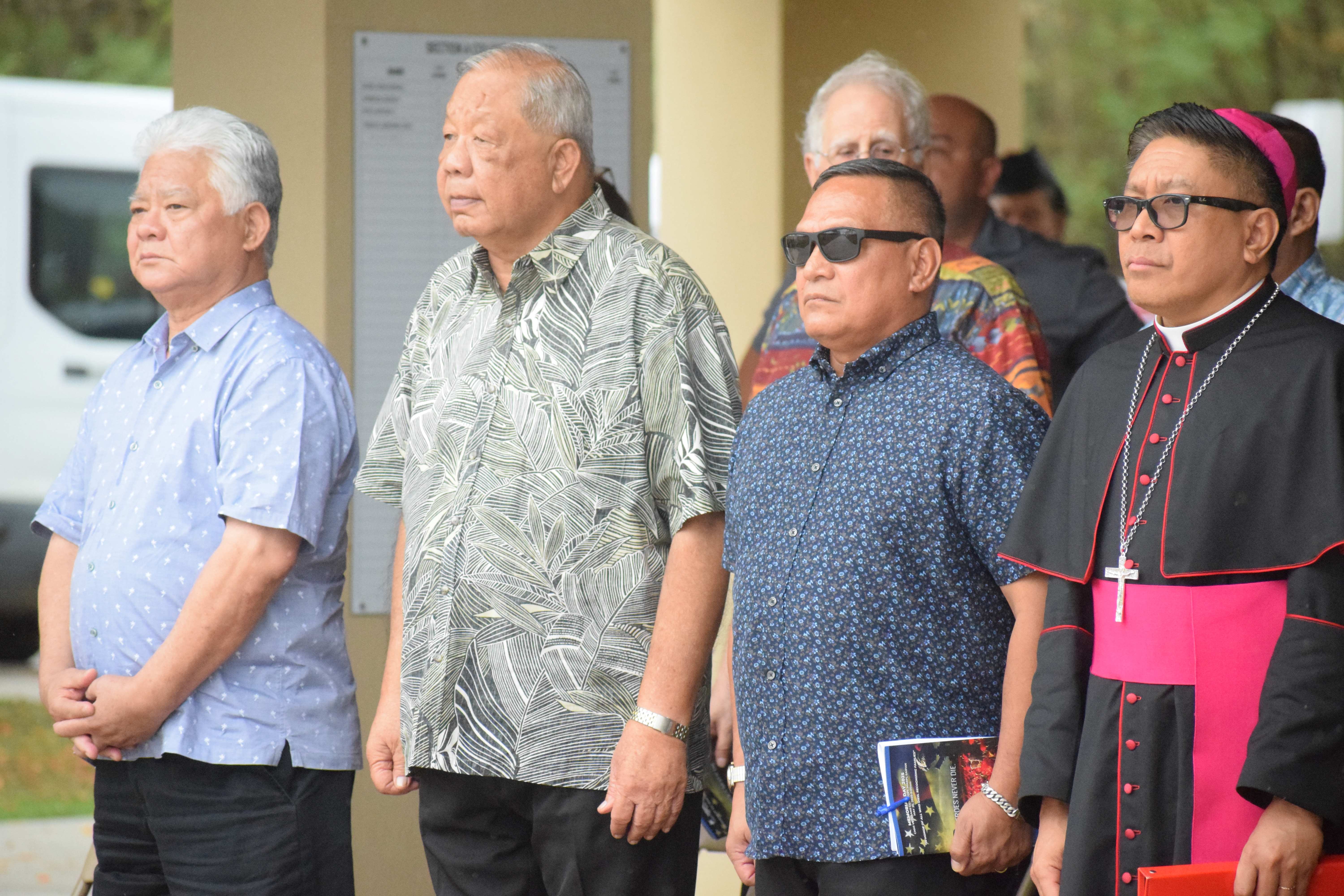 From left, Gov. Arnold I. Palacios, Lt. Gov. David M. Apatang, Special Assistant for Military Affairs Edward C. Camacho and Bishop Romeo D. Convocar stand at attention during the posting of colors.