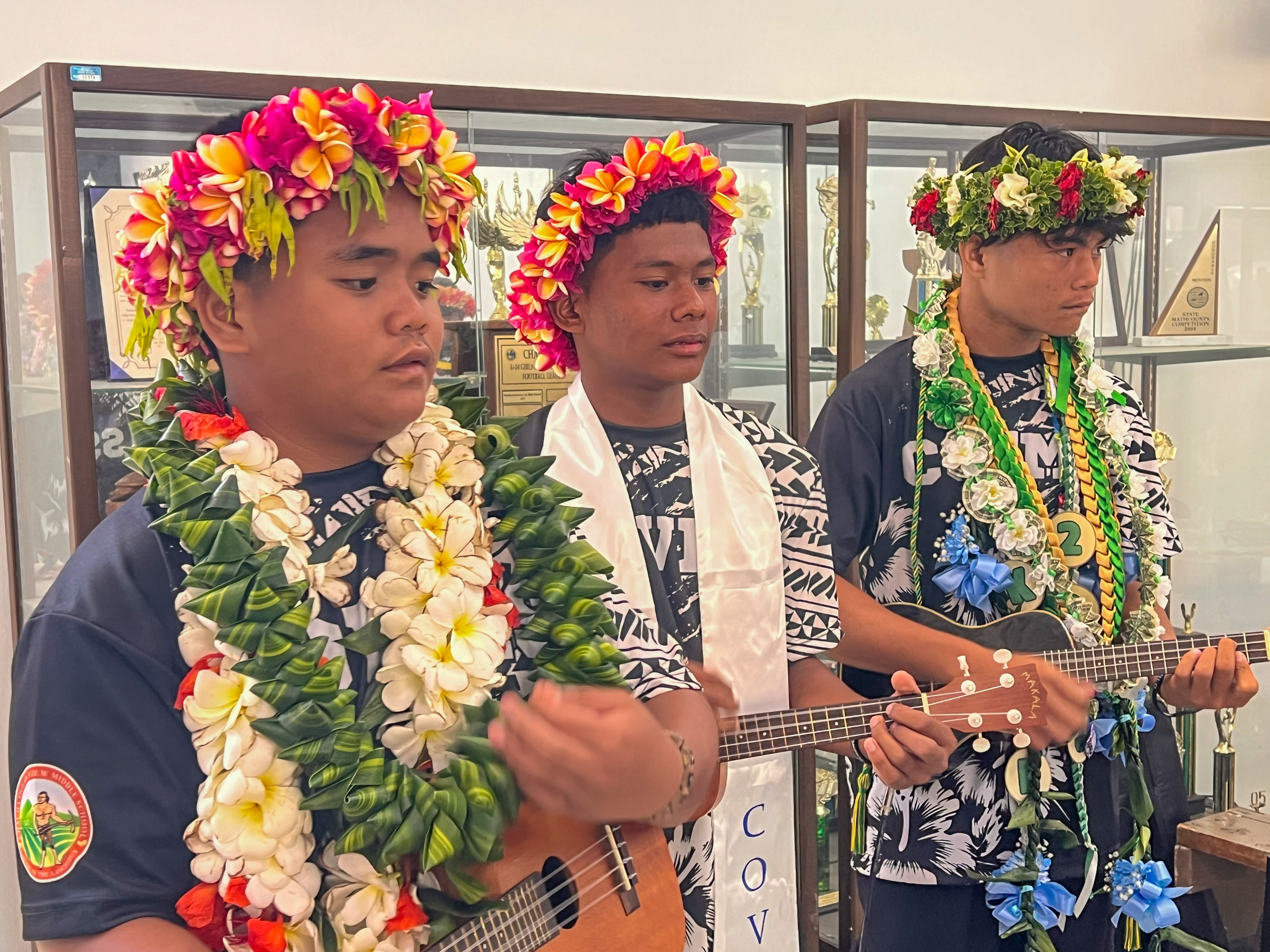  Promoted students take part in a musical performance.