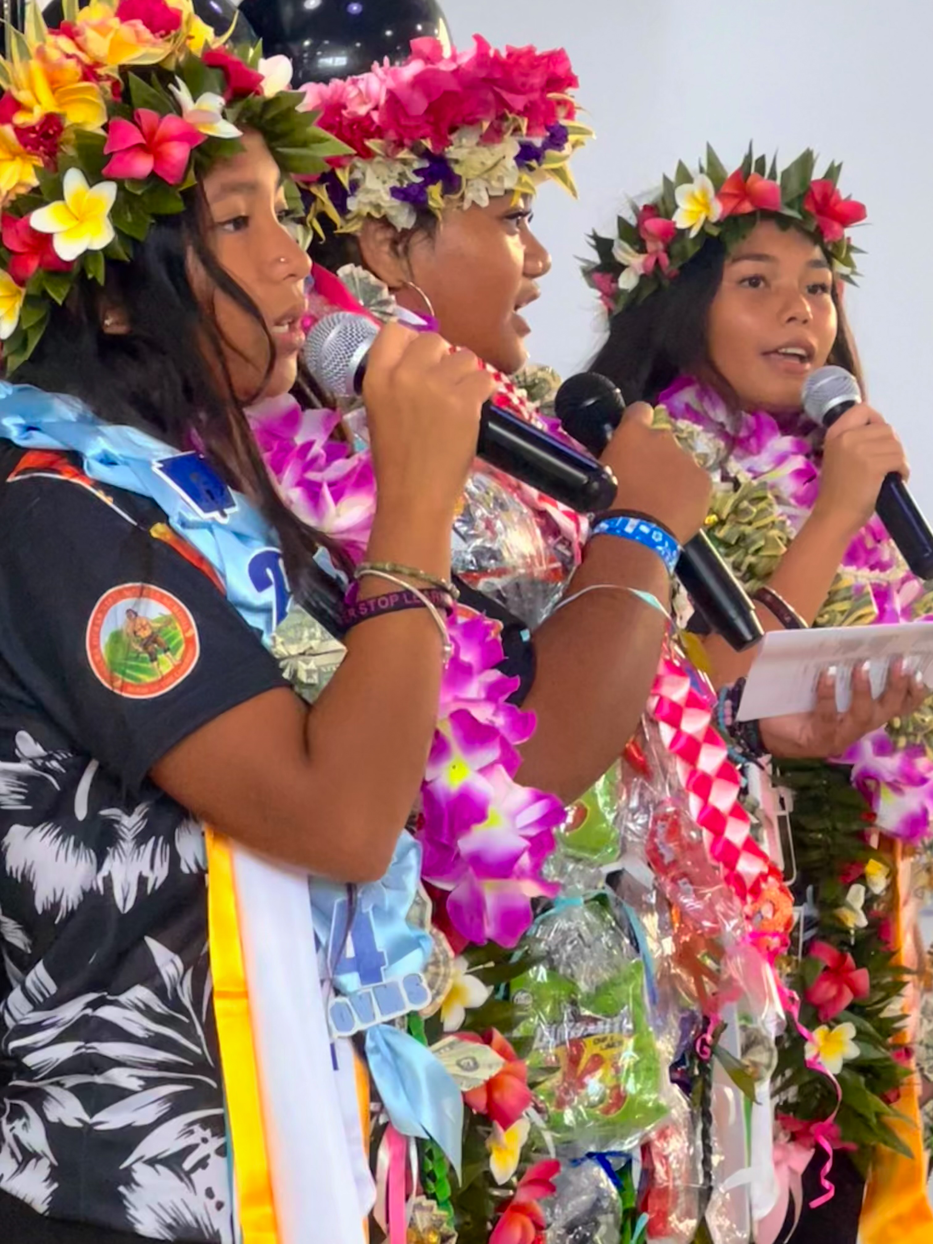 Three eight-graders led the singing of the national and CNMI anthems.