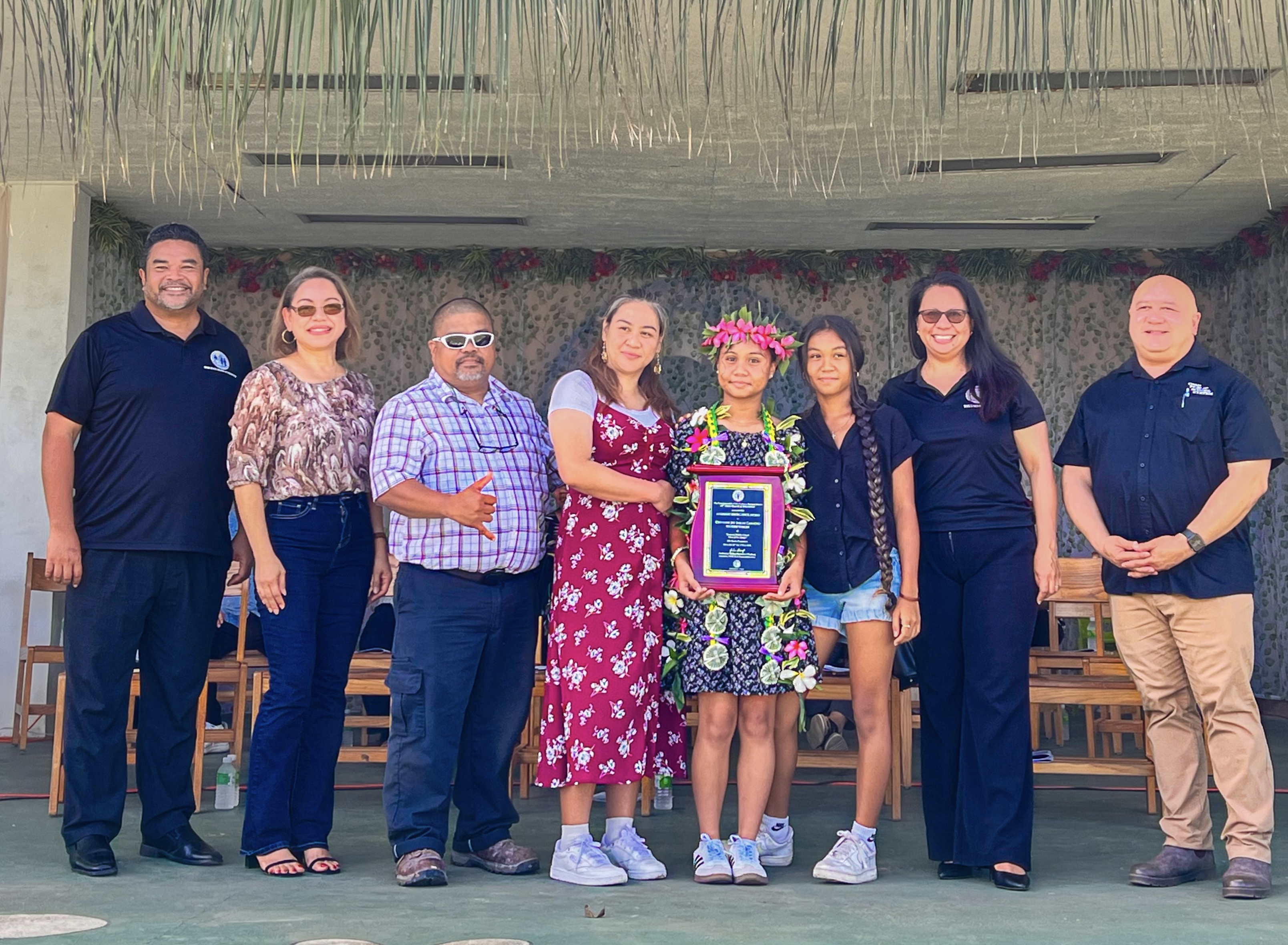 Valedictorian Cheyenne Joy S. Camacho, center, poses with her proud parents along with BOE Chairman Aschumar Kodep Ogumoro-Uludong, BOE member Maisie B. Tenorio and Commissioner of Education Dr. Lawrence F. Camacho, right.